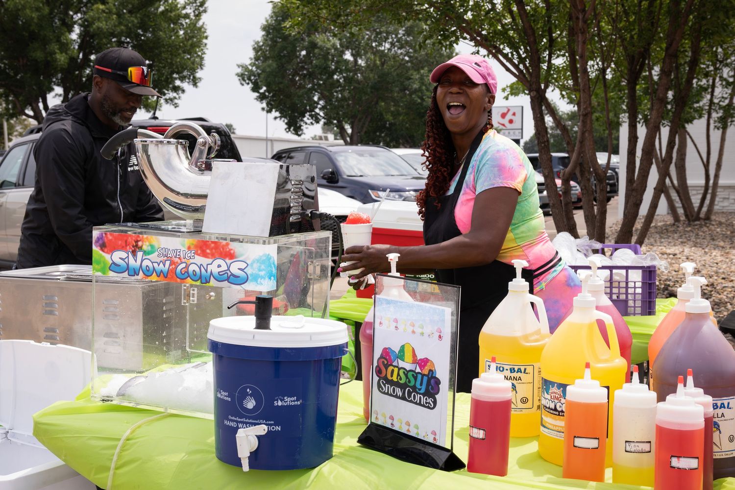 Outdoor market with vendors selling clothing and accessories, photographed by Sioux Falls fashion photographer.