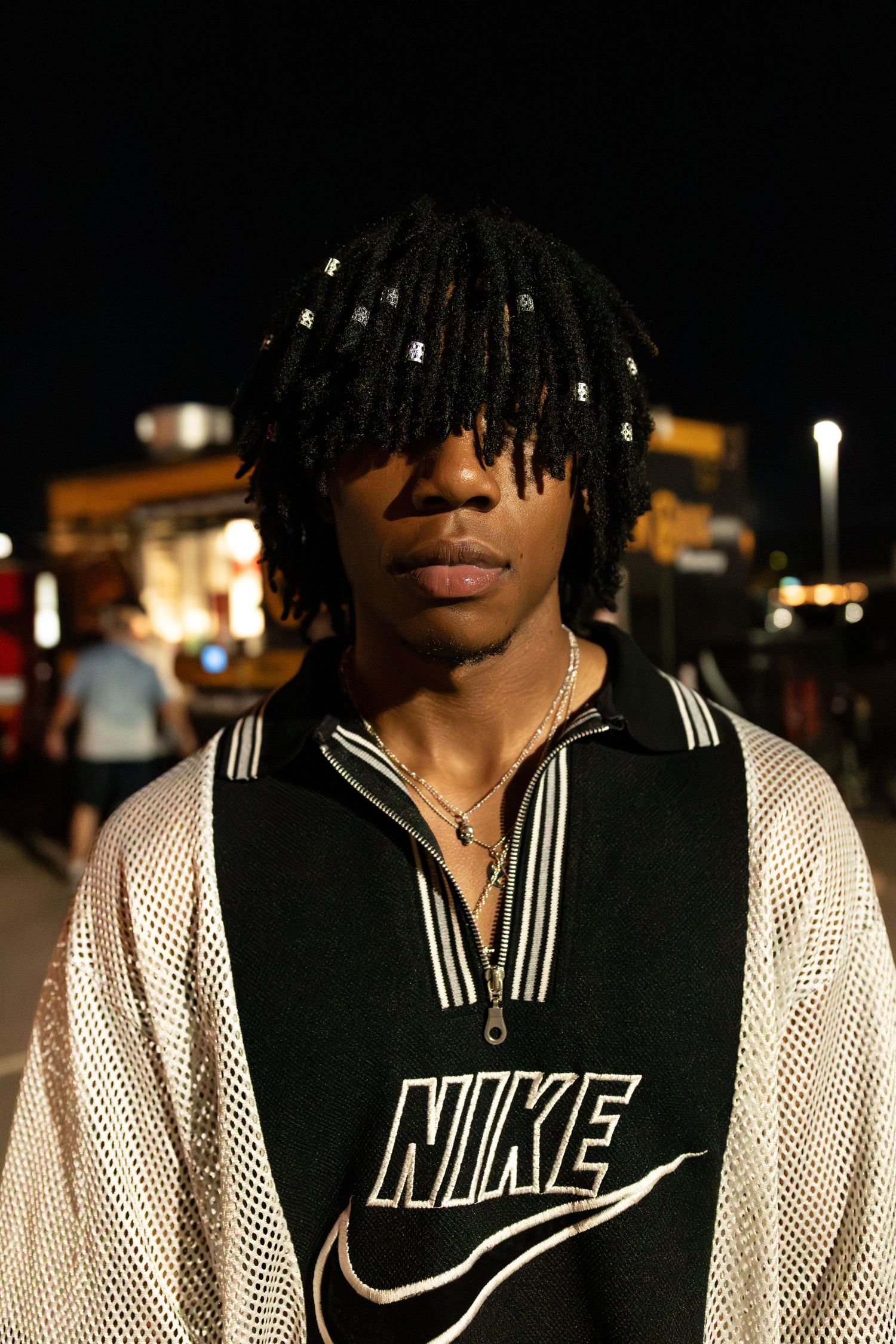 Street style fashion looks at an outdoor Sioux Falls fashion event with creative outfit choices, photographed by pro fashion photographer.