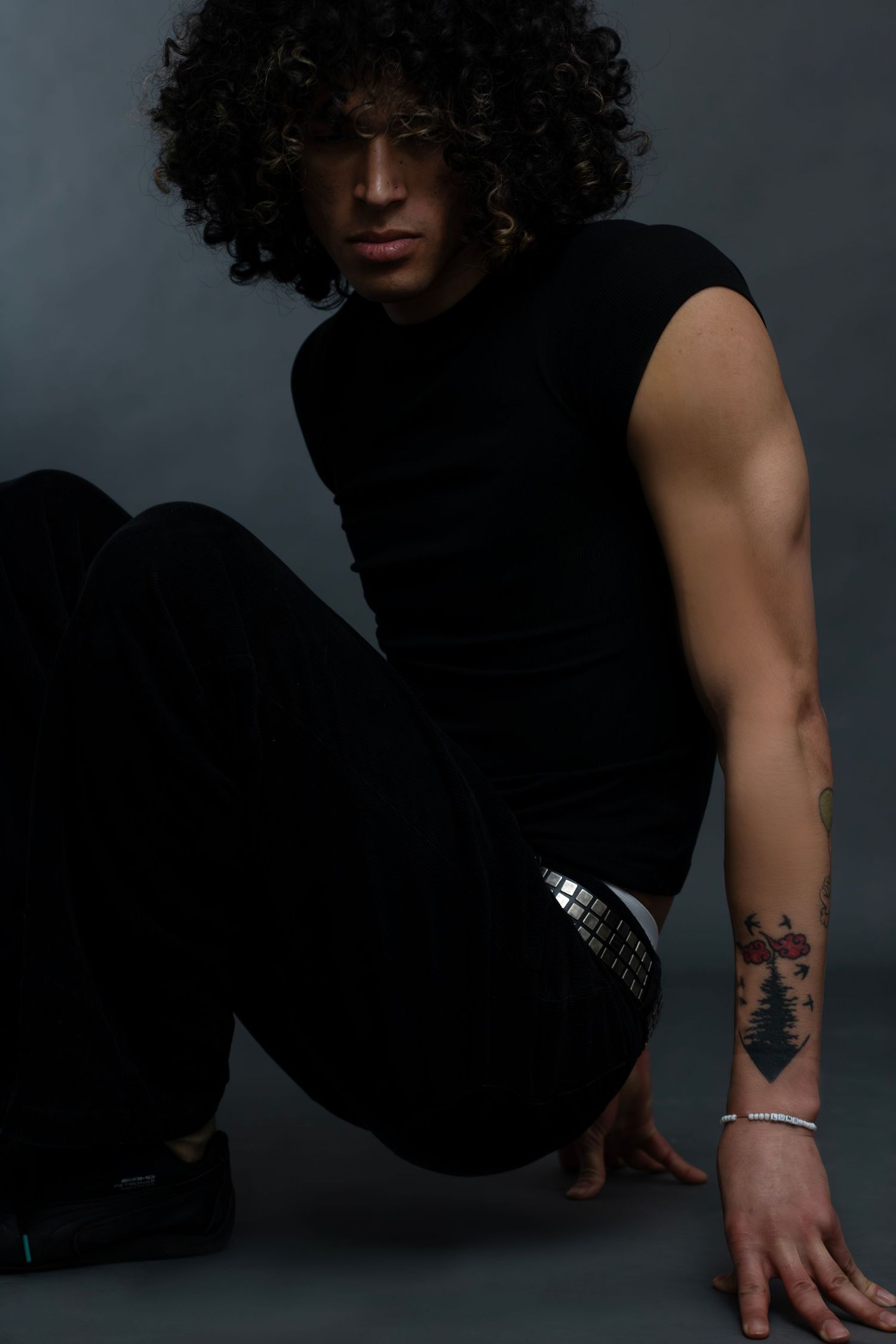 Fashion-forward editorial studio portrait of male model, captured by Sioux Falls photographer showcasing modern style, concept, and personal