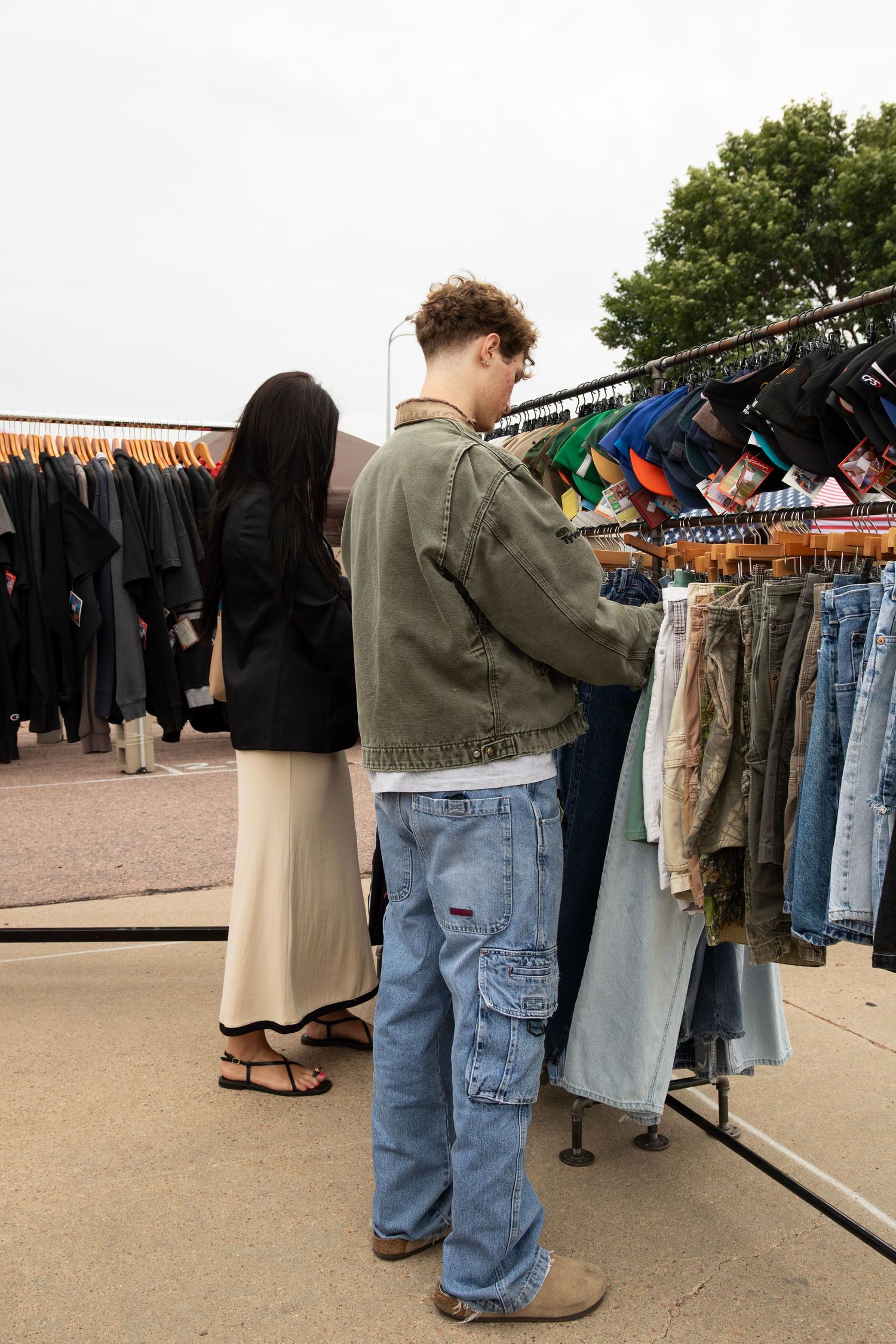 People browsing and enjoying an outdoor fashion market, photographed by Sixtwentytwo Images, a local professional fashion photographer.