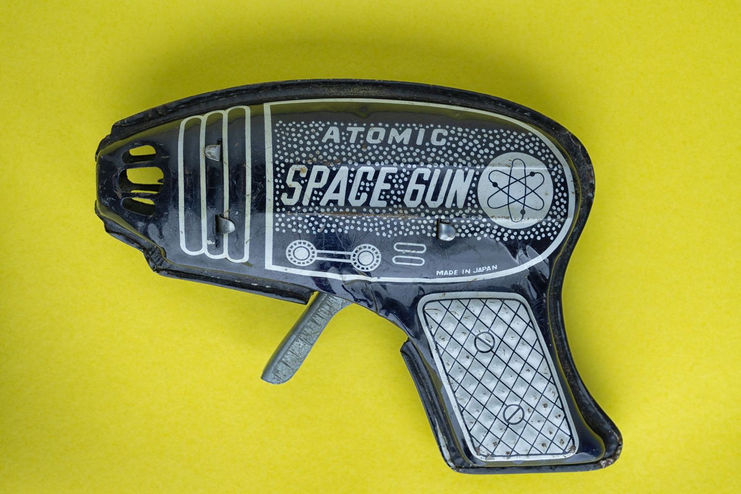 atomic space gun 1960s tin toy black and yellow fine art photograph by Richard Simpson