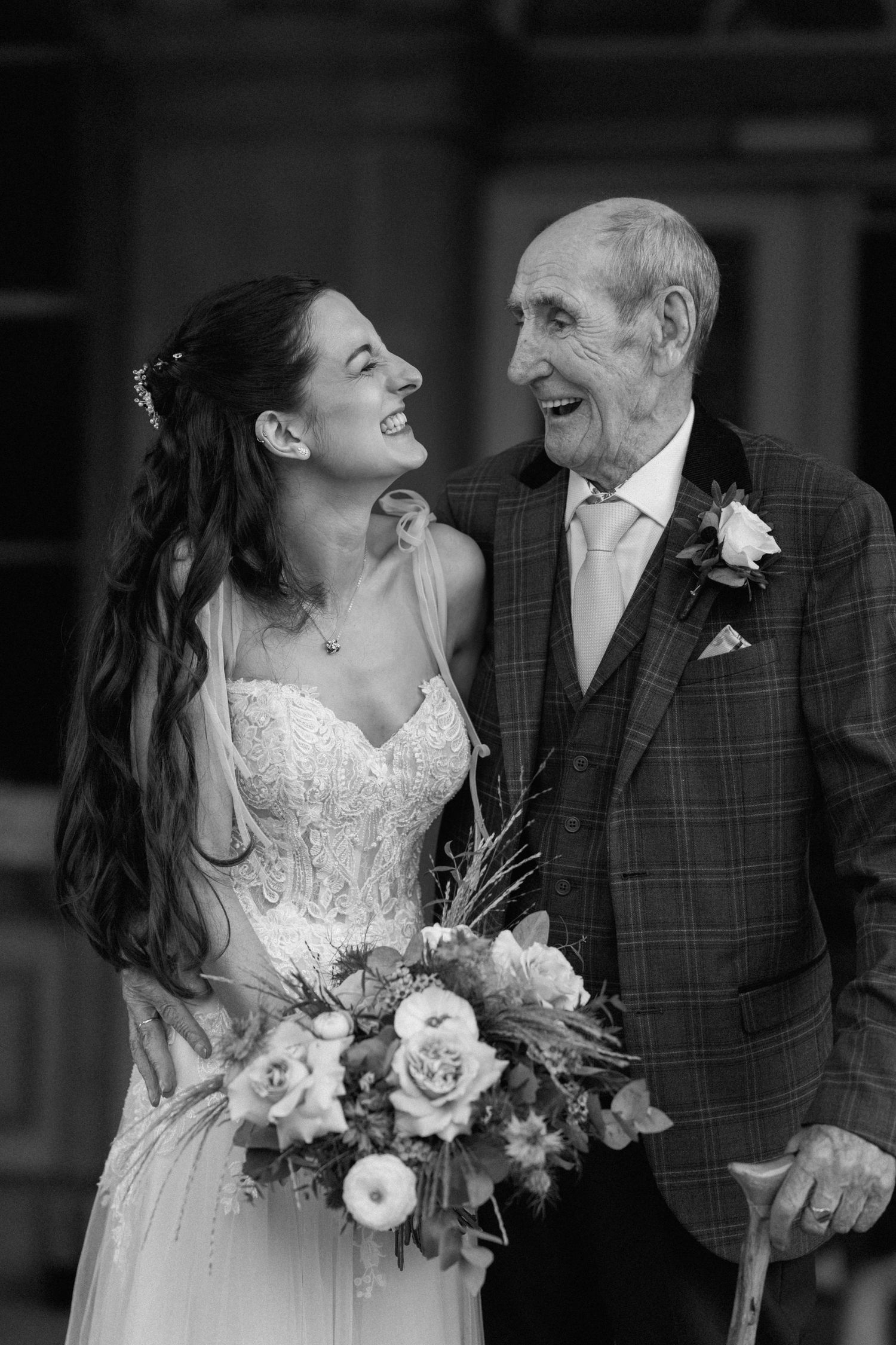 Tender moment captured in black and white between bride and elderly relative at wedding at Prestwold Hall.