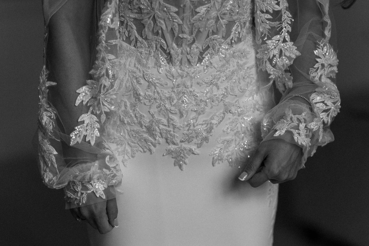 Wedding dress shots featuring intricate lace details, buttons, and closeup views of exquisite bridal gown construction.