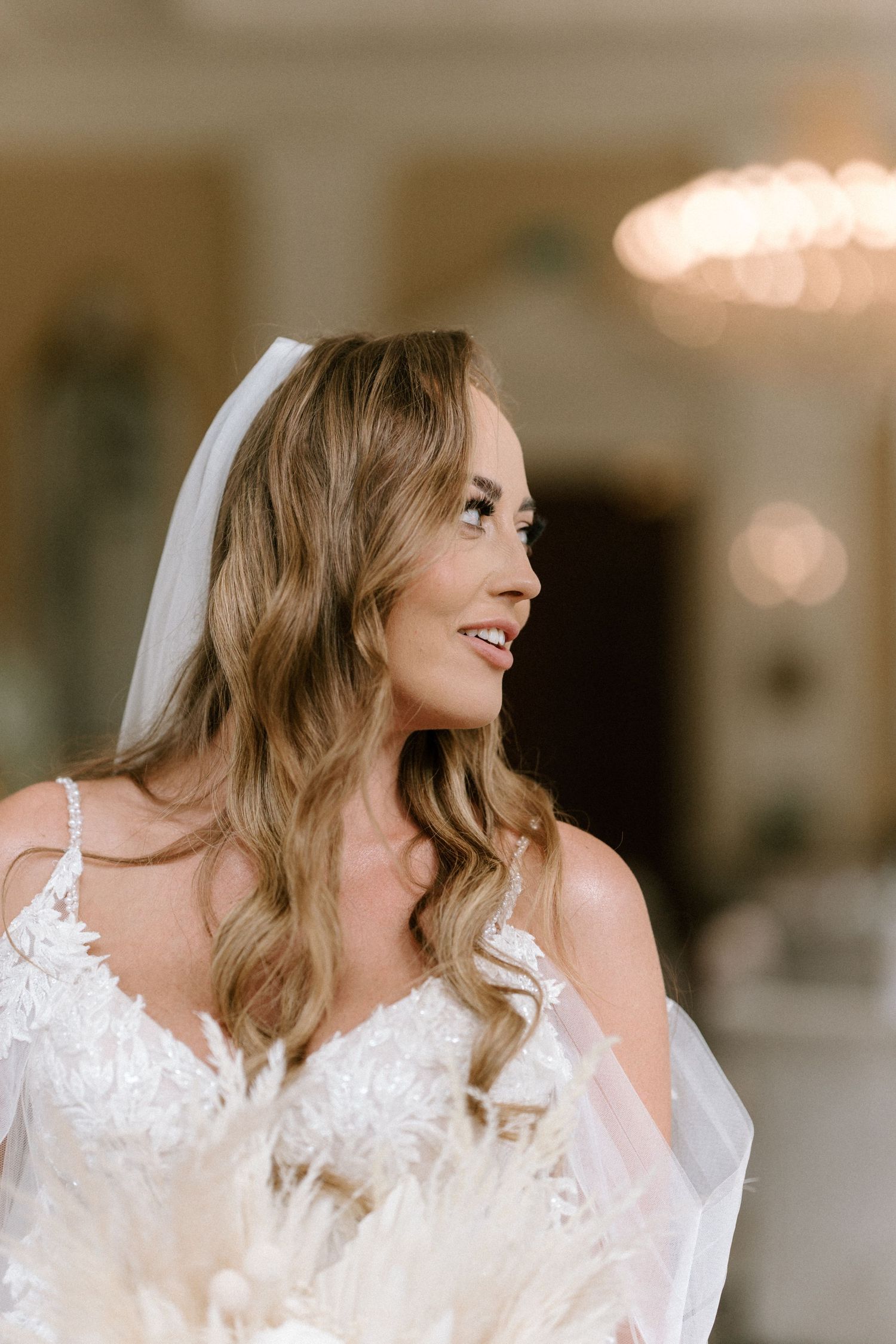 Close-up wedding portrait with soft lighting and elegant bridal details.