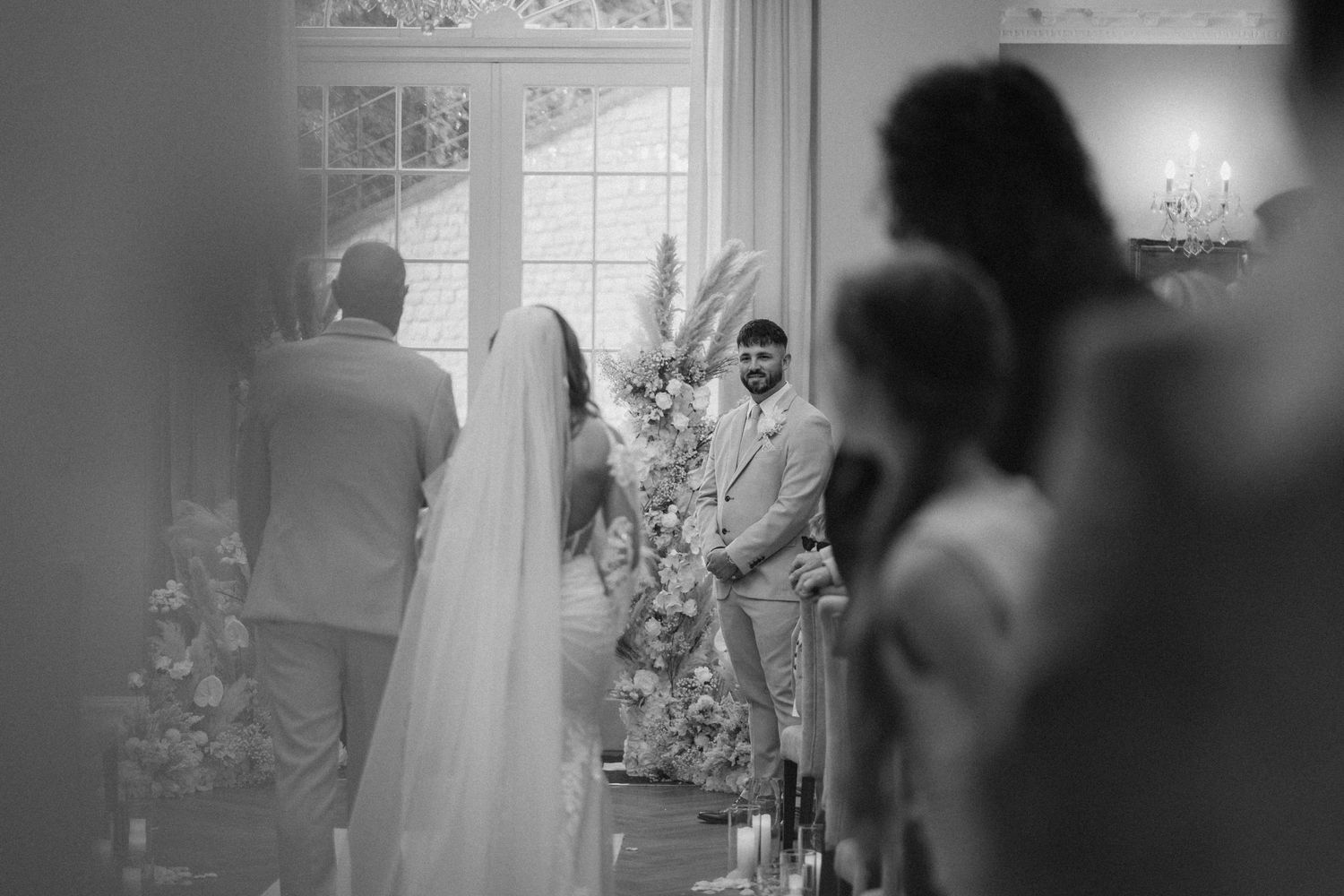 Black and white series of candid moments from a wedding ceremony showing intimate details and emotional interactions.
