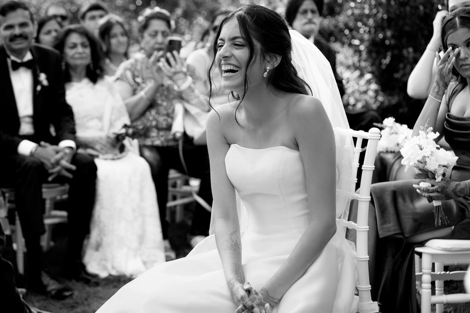 A black and white collage of wedding moments showing laughter and joy during an outdoor celebration.