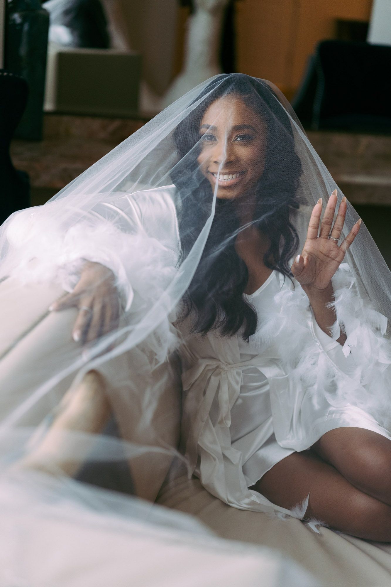 A sequence of artistic bridal portraits showing a person under flowing white tulle veil in soft natural light.