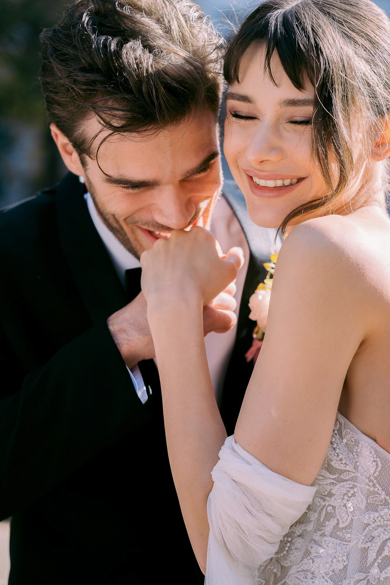 A romantic series of close-up shots showing tender moments between newlyweds in soft lighting.
