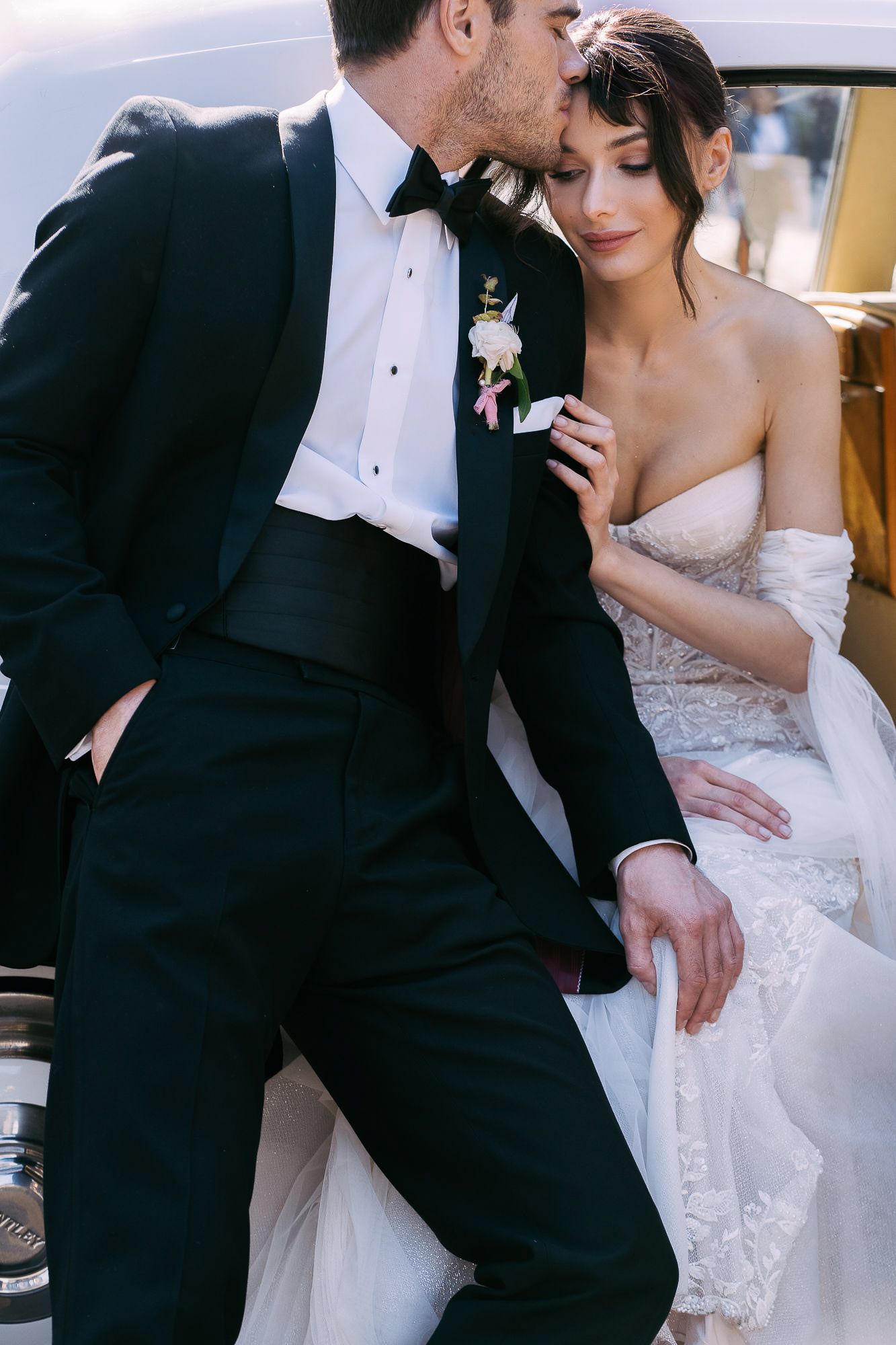 A romantic wedding couple in formal attire share intimate moments in a series of black and white photographs.