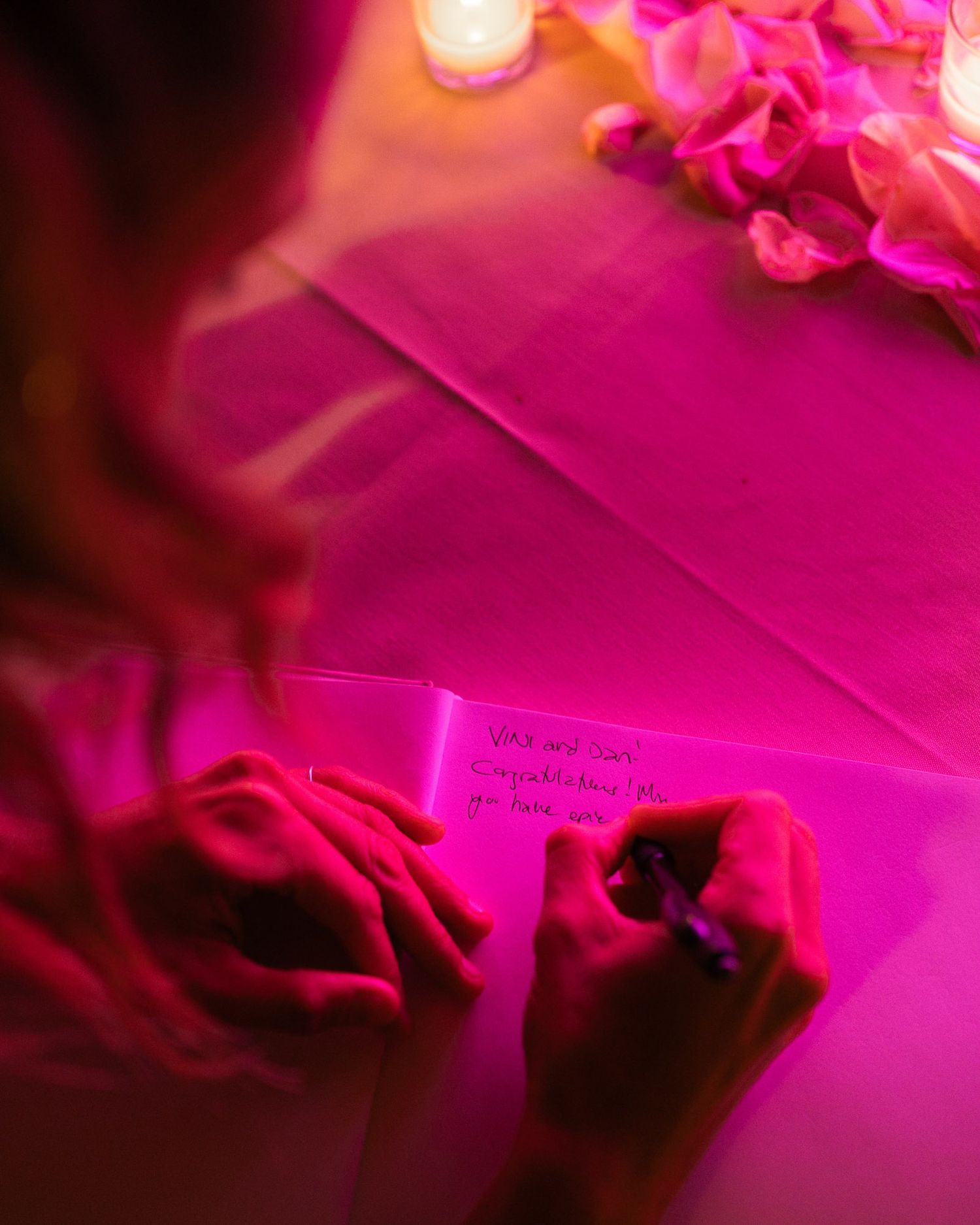Abstract pink and purple floral arrangement with soft bokeh lighting effects creates a dreamy romantic atmosphere.