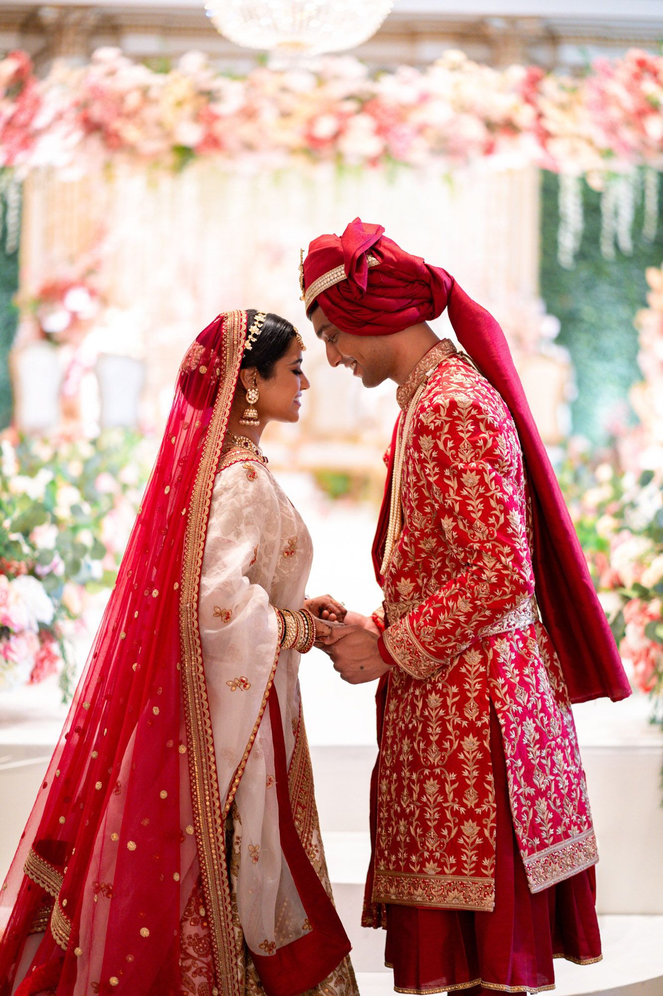 A couple in traditional South Asian wedding attire shares intimate moments in a series of romantic photos.