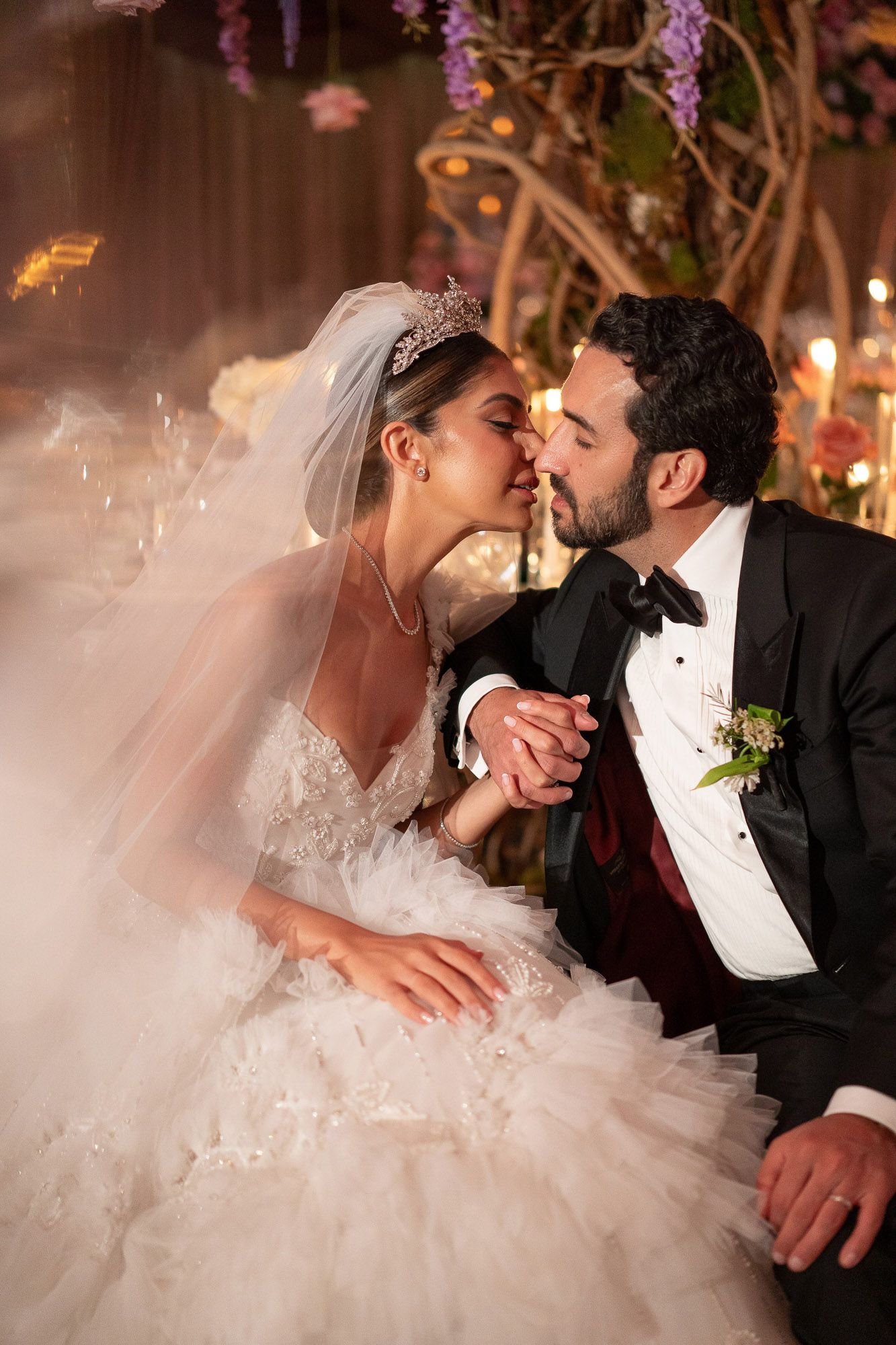 A romantic wedding photo sequence showing tender moments between newlyweds with purple floral decor in the background.