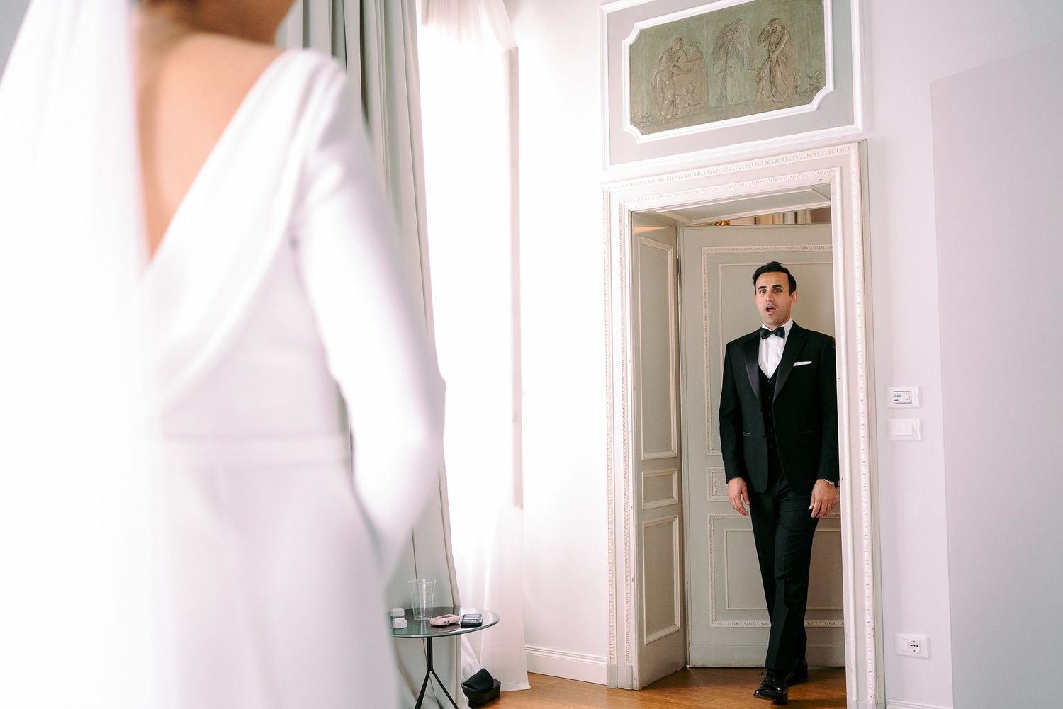 A collage of interior doorways and hallways in a bright white room with light hardwood floors.