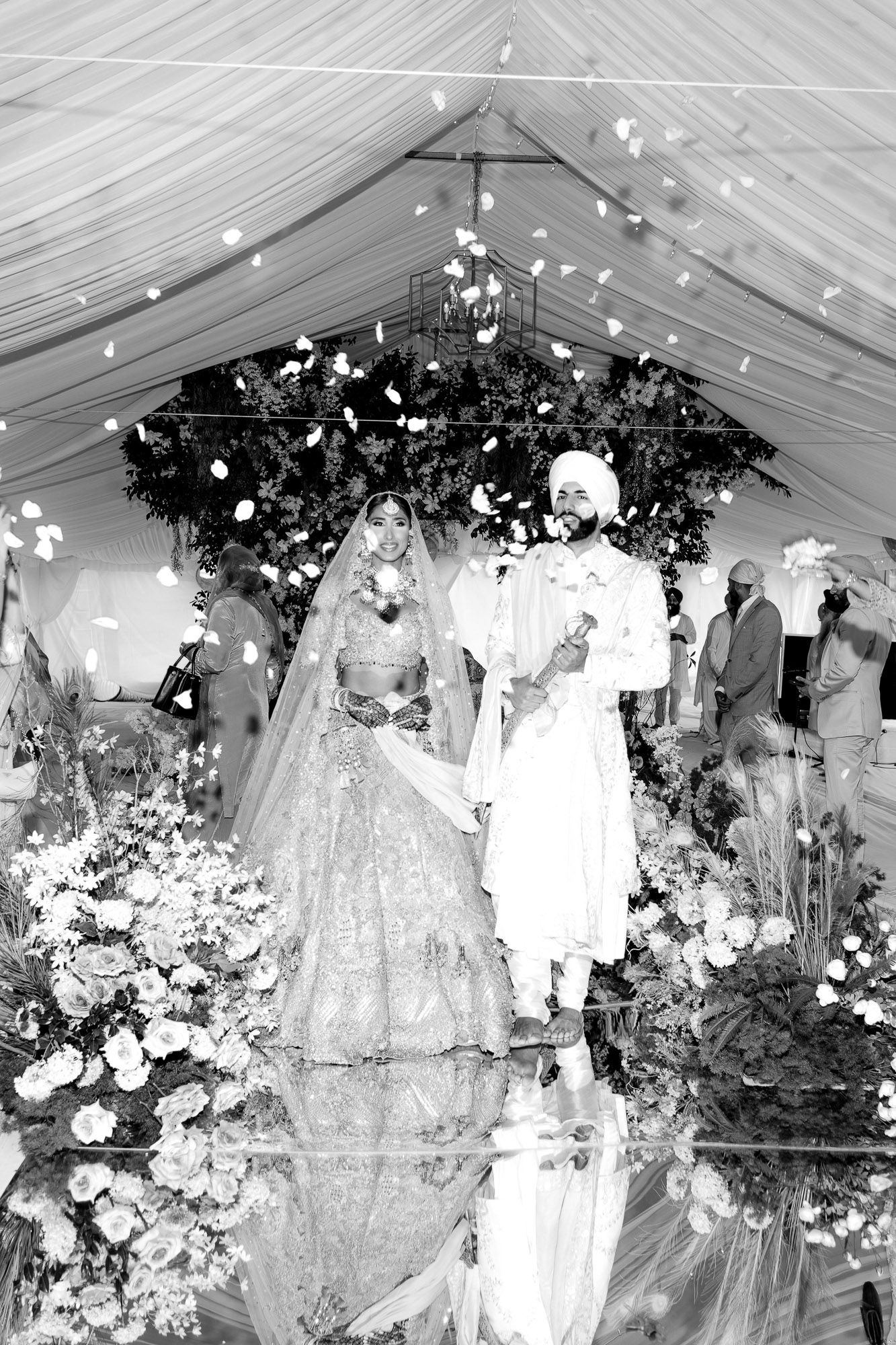A series of vintage black and white wedding photographs showing bridal parties in a decorated reception venue.
