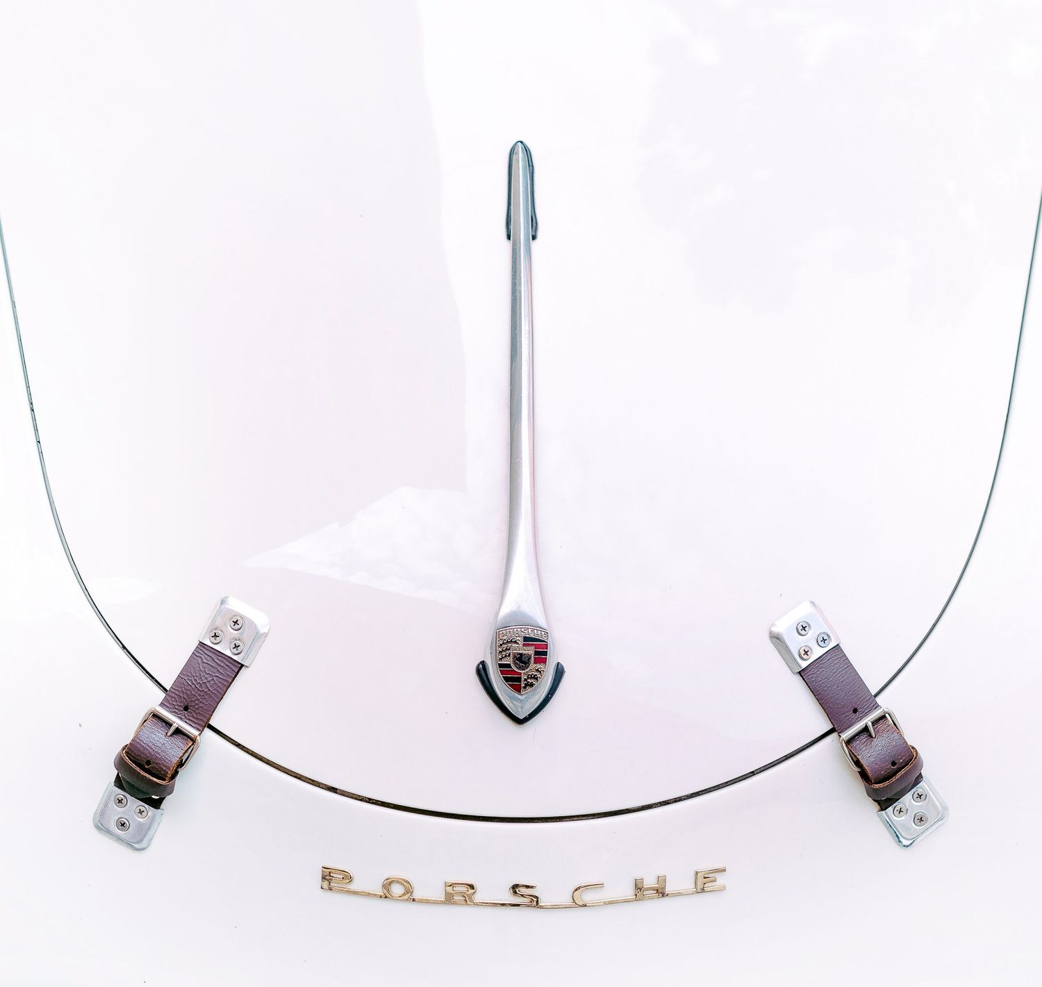 Elegant silver Porsche necklace with delicate chain displayed in multiple angles showing detailed pendant design.