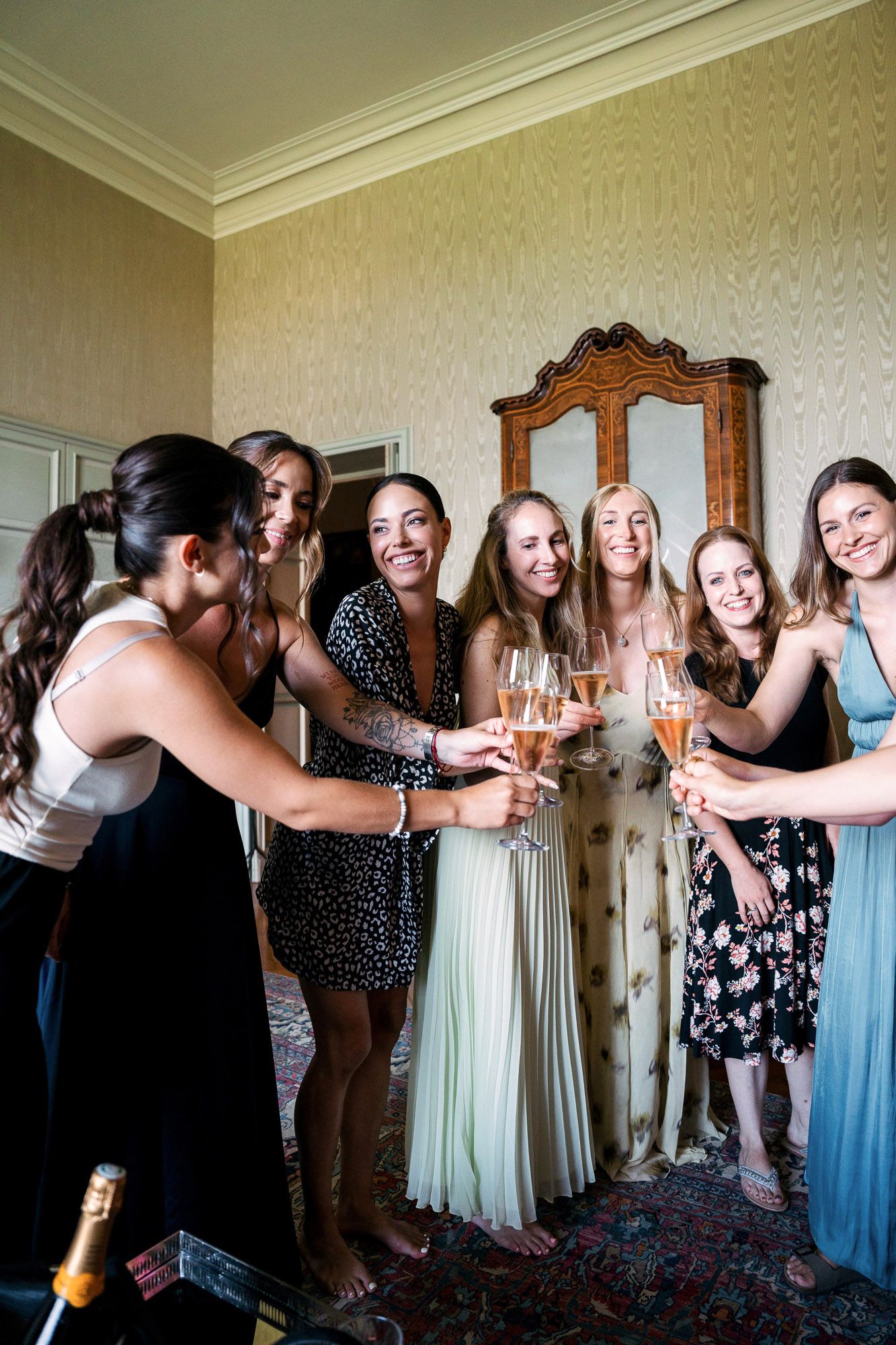 A group in formal attire celebrates with champagne at a special event, creating a sequence of candid moments.