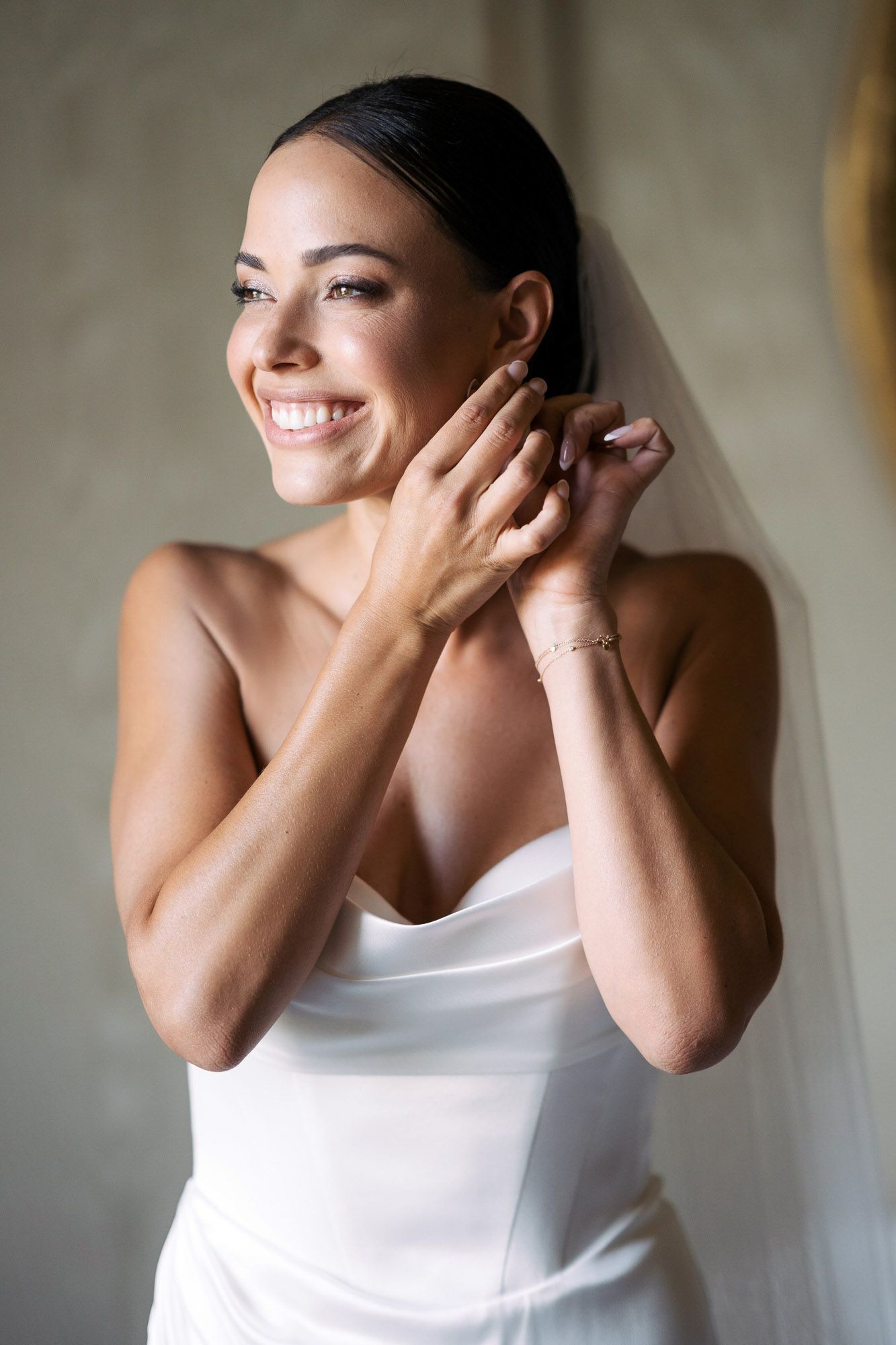 A sequence of joyful expressions and candid moments captured in natural light against a neutral background.