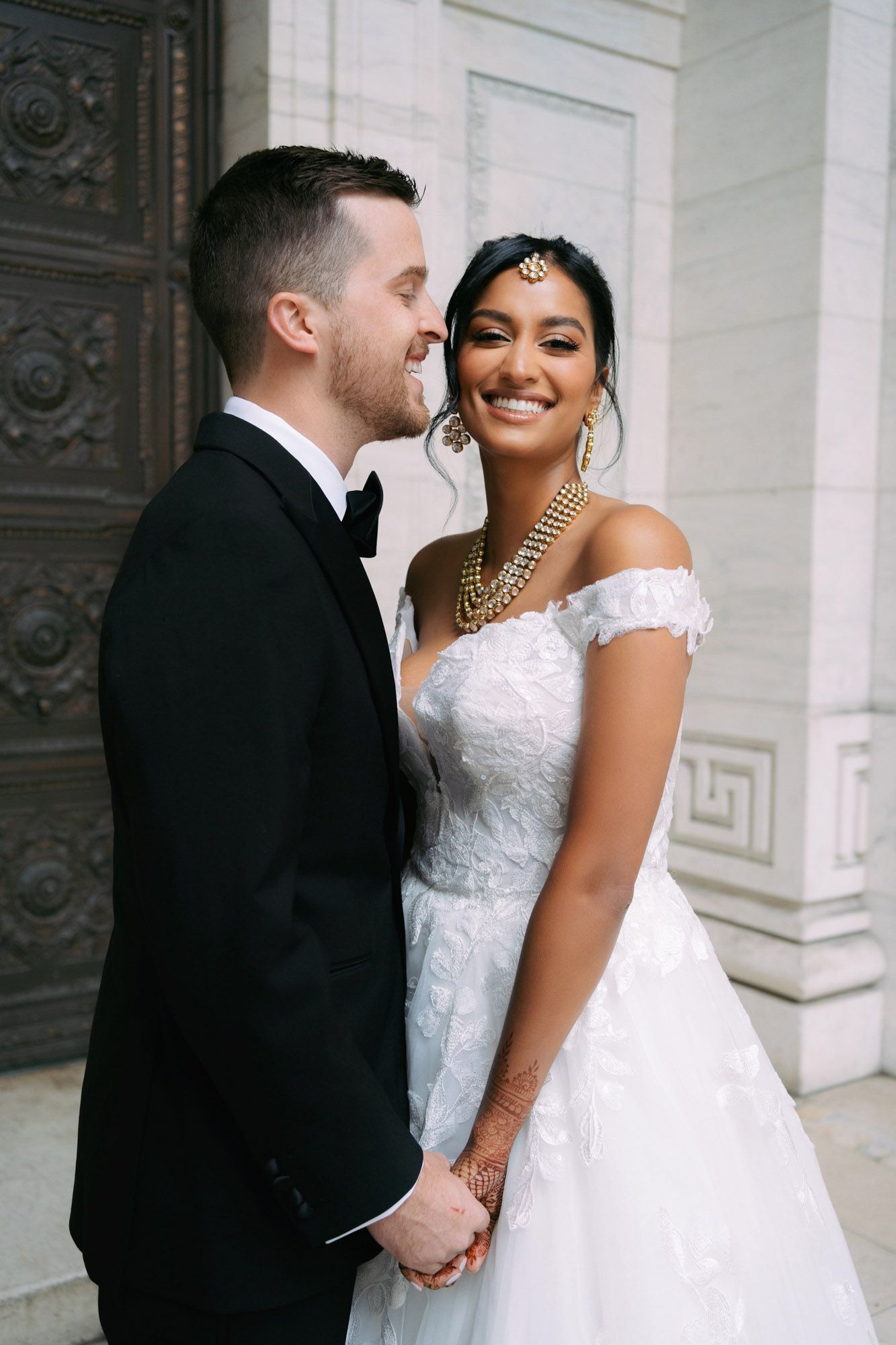 A romantic wedding couple shares intimate moments together in a series of elegant architectural photos.