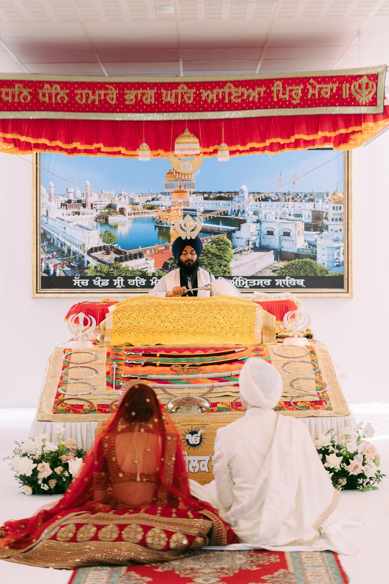 Panoramic view of a Sikh wedding ceremony showing multiple moments of traditional rituals under decorated canopies.