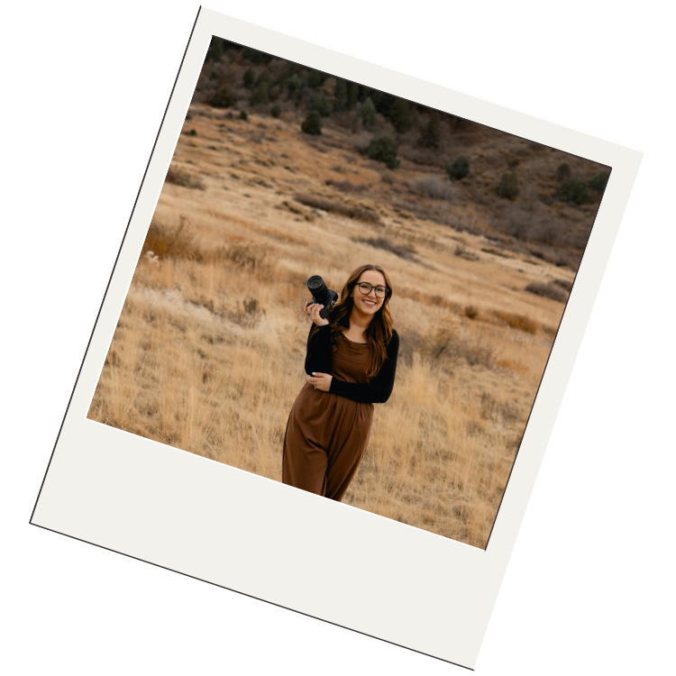 Person in brown dress stands in a golden field during sunset with soft lighting and warm earth tones.