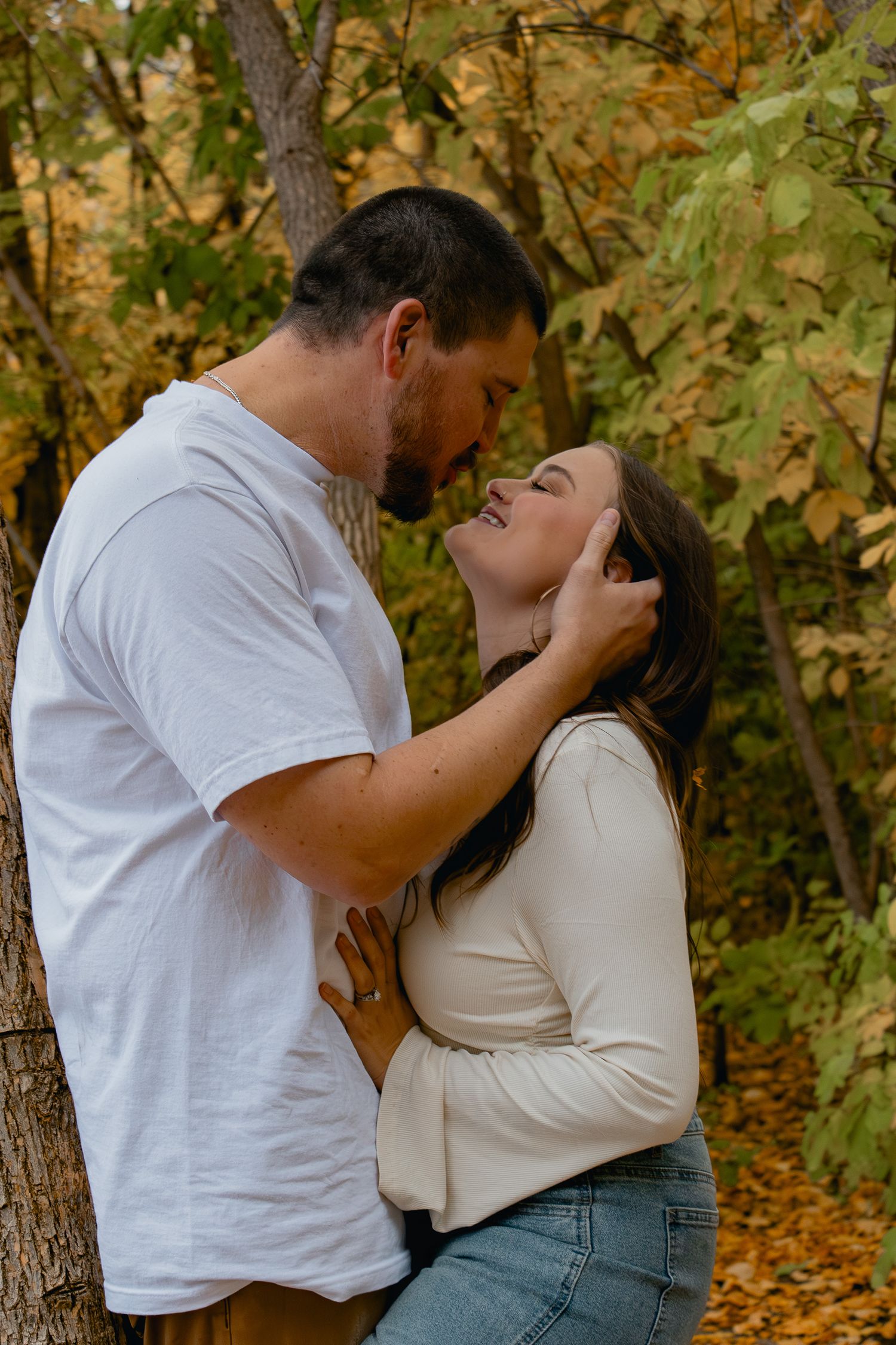 A romantic autumn photo sequence shows a couple embracing against a backdrop of fall foliage and trees.