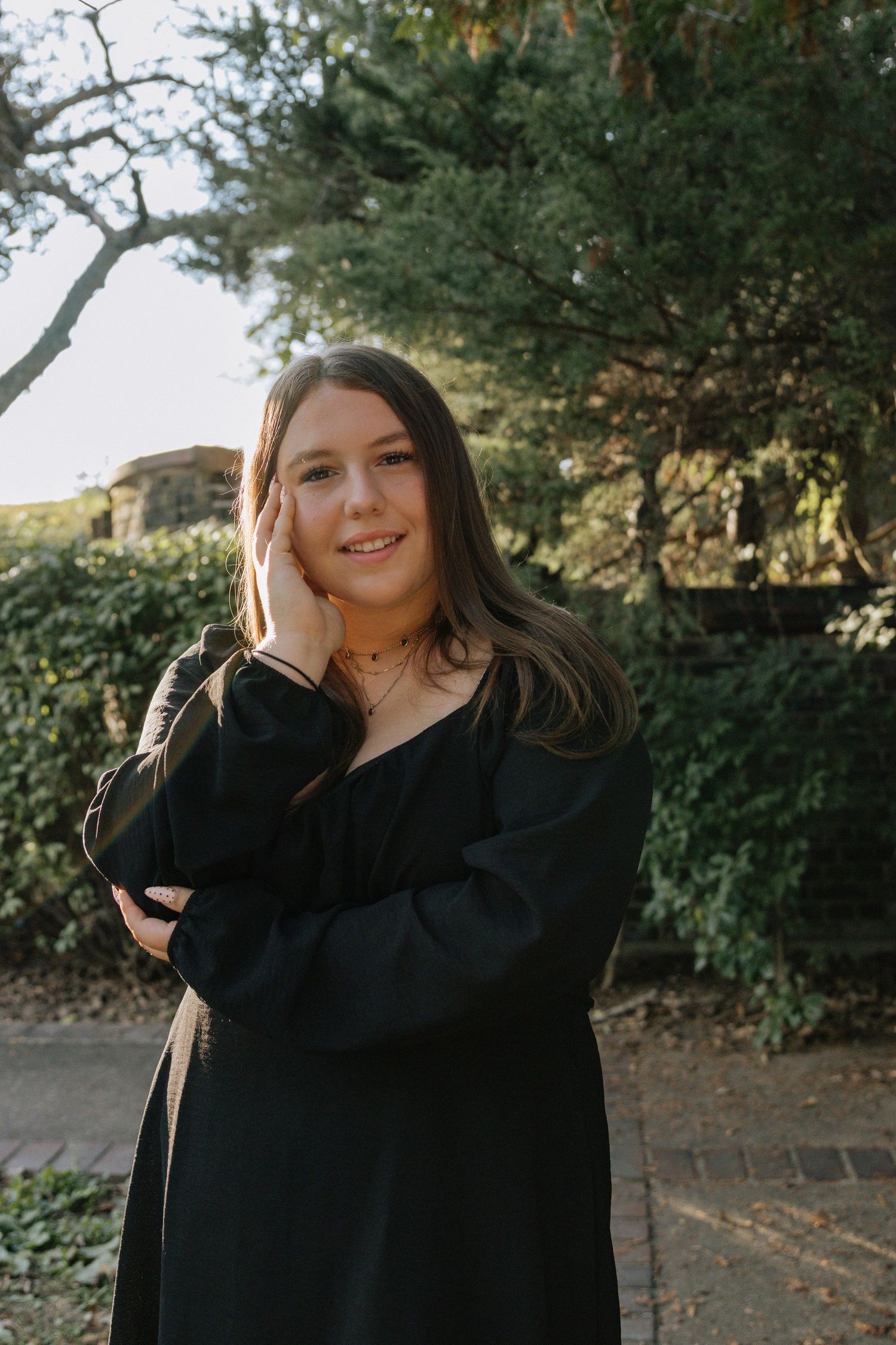 Outdoor portrait series showing playful expressions among autumn foliage.