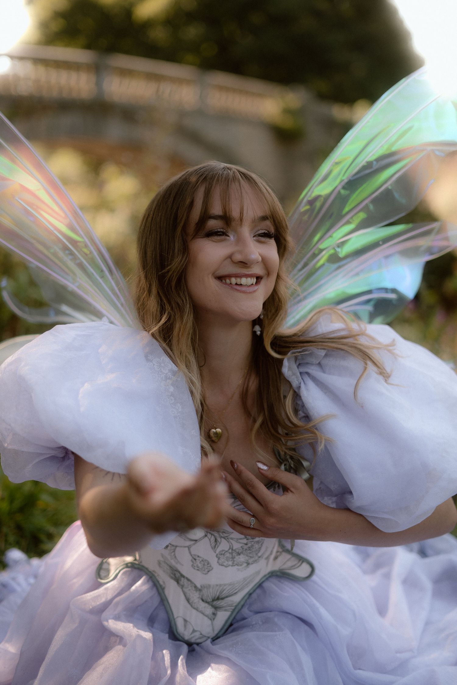 A person in a white flowing dress twirls joyfully in a series of dynamic outdoor portrait shots.