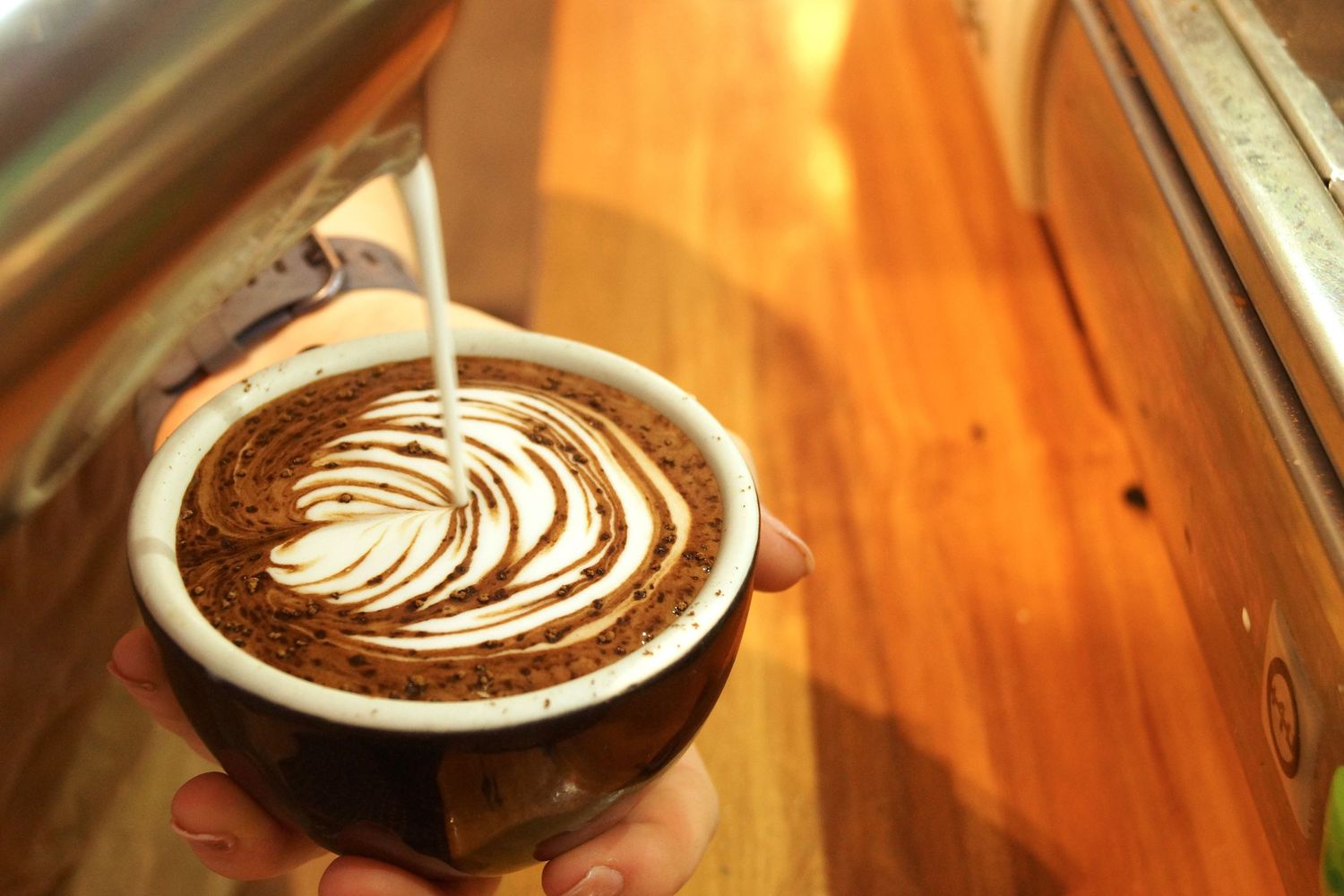 Latte art coffee pouring barista commercial photography