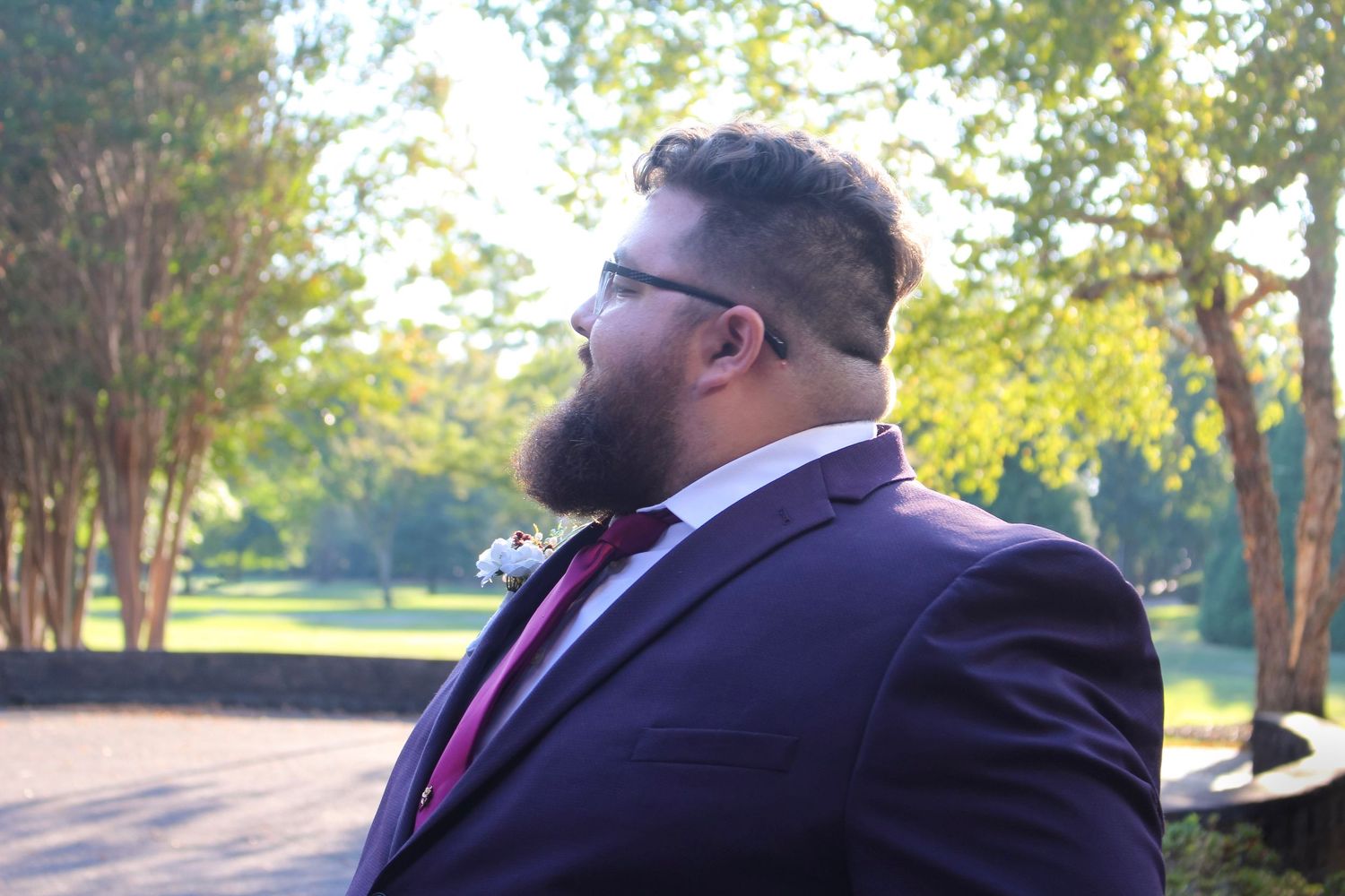 This is a photo of the groom from the wedding taking a break outside during the post-ceremony photos.