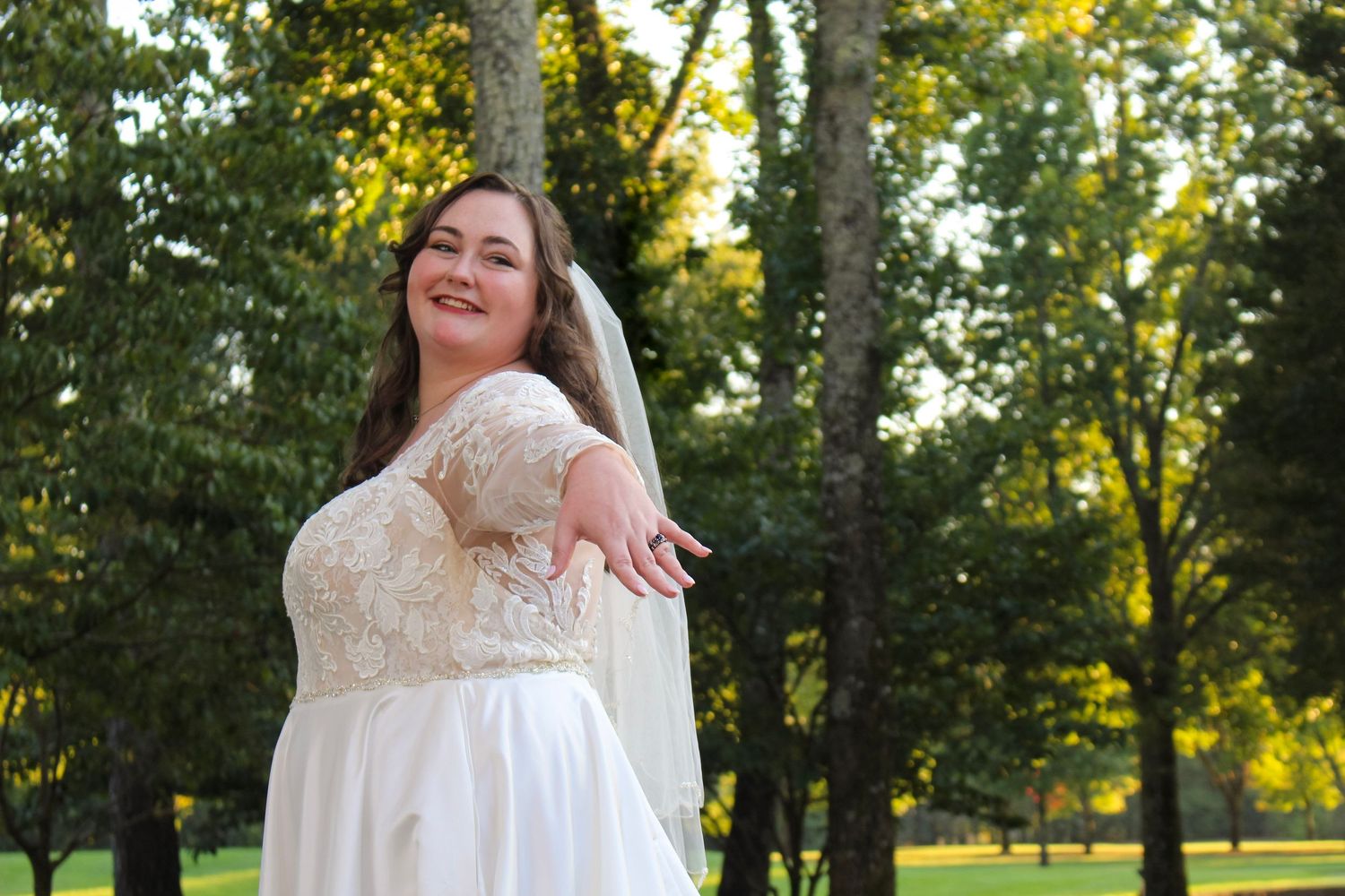 This is another angle of the bride showing off her ring.