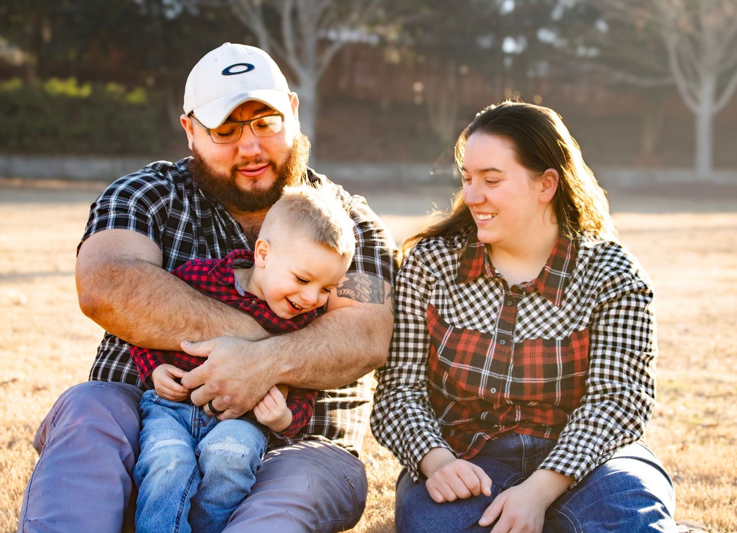 This is a photo of the family, the bride and groom to be and their little boy.
