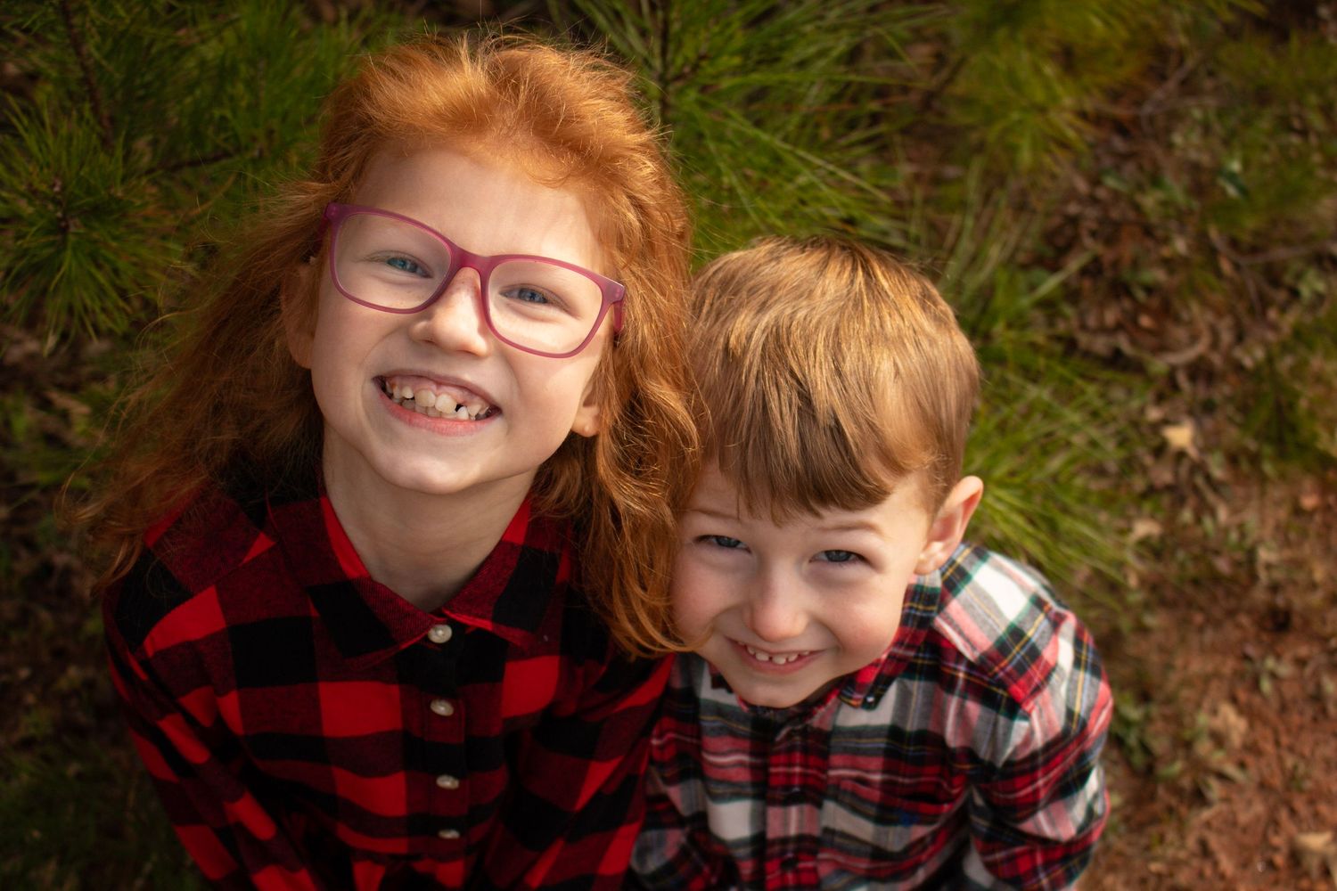 This is a close up angle of two of the kids from the diverse family.