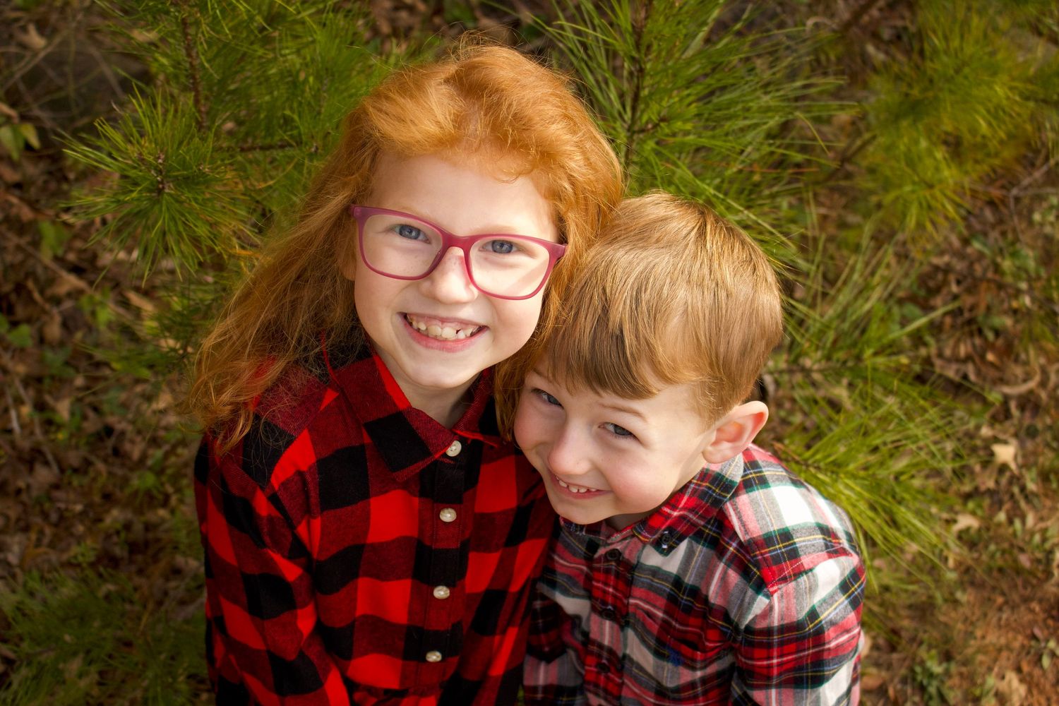 This is a close up angle of two of the kids from the diverse family.