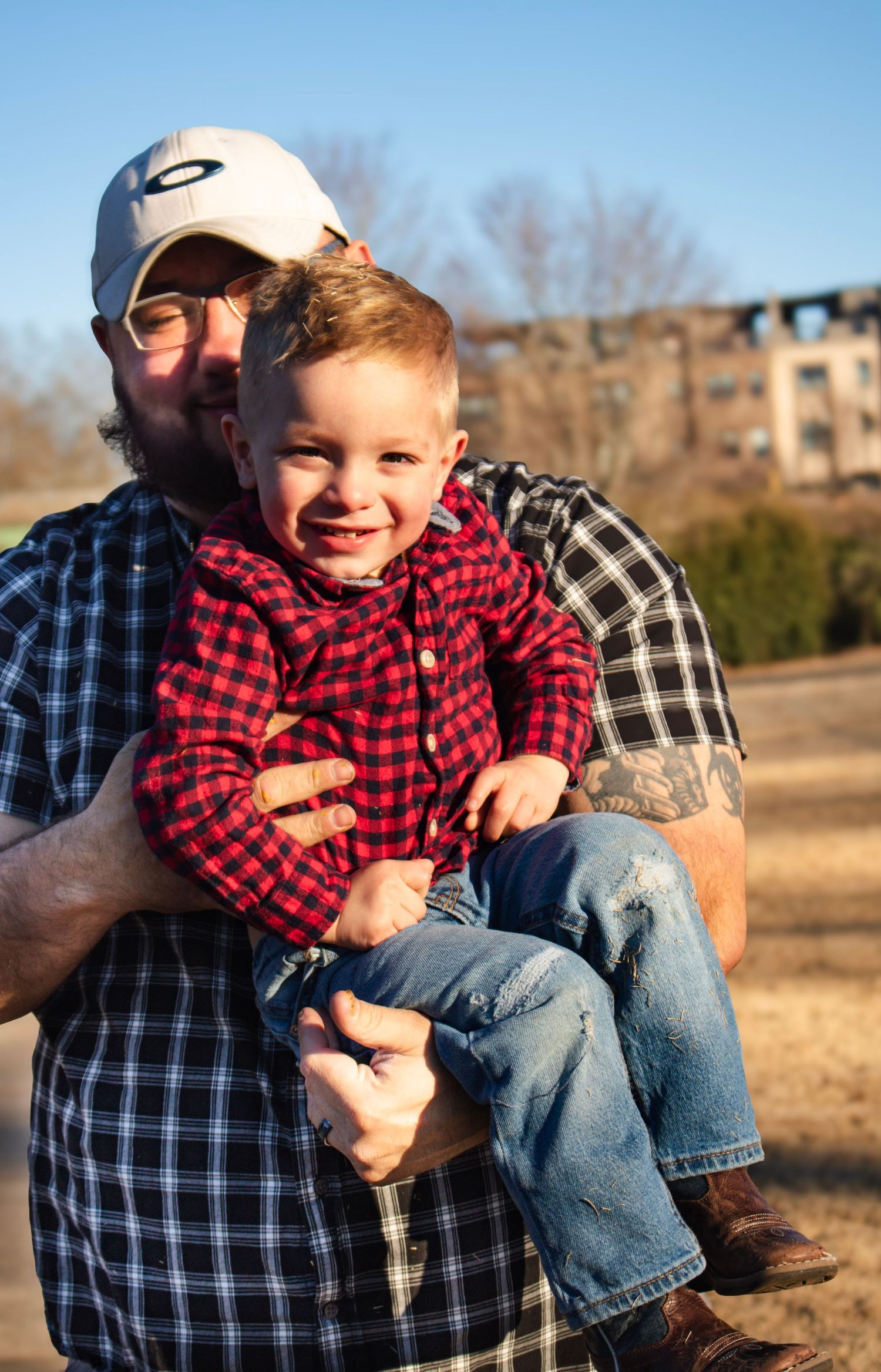 This is a photo of a dad holding his kid up.