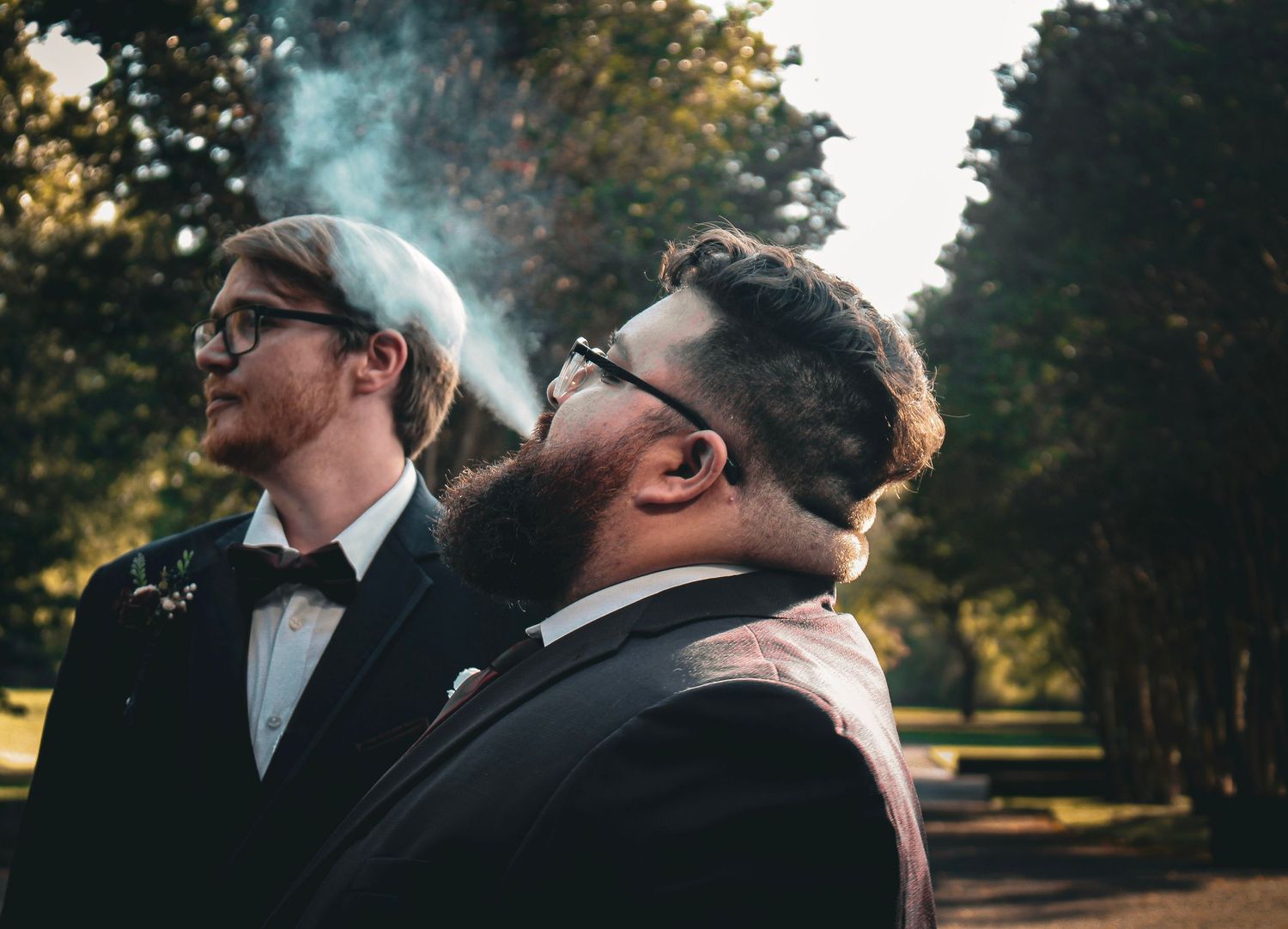 This is a photo of the groom from the wedding taking a break outside during the post-ceremony photos.
