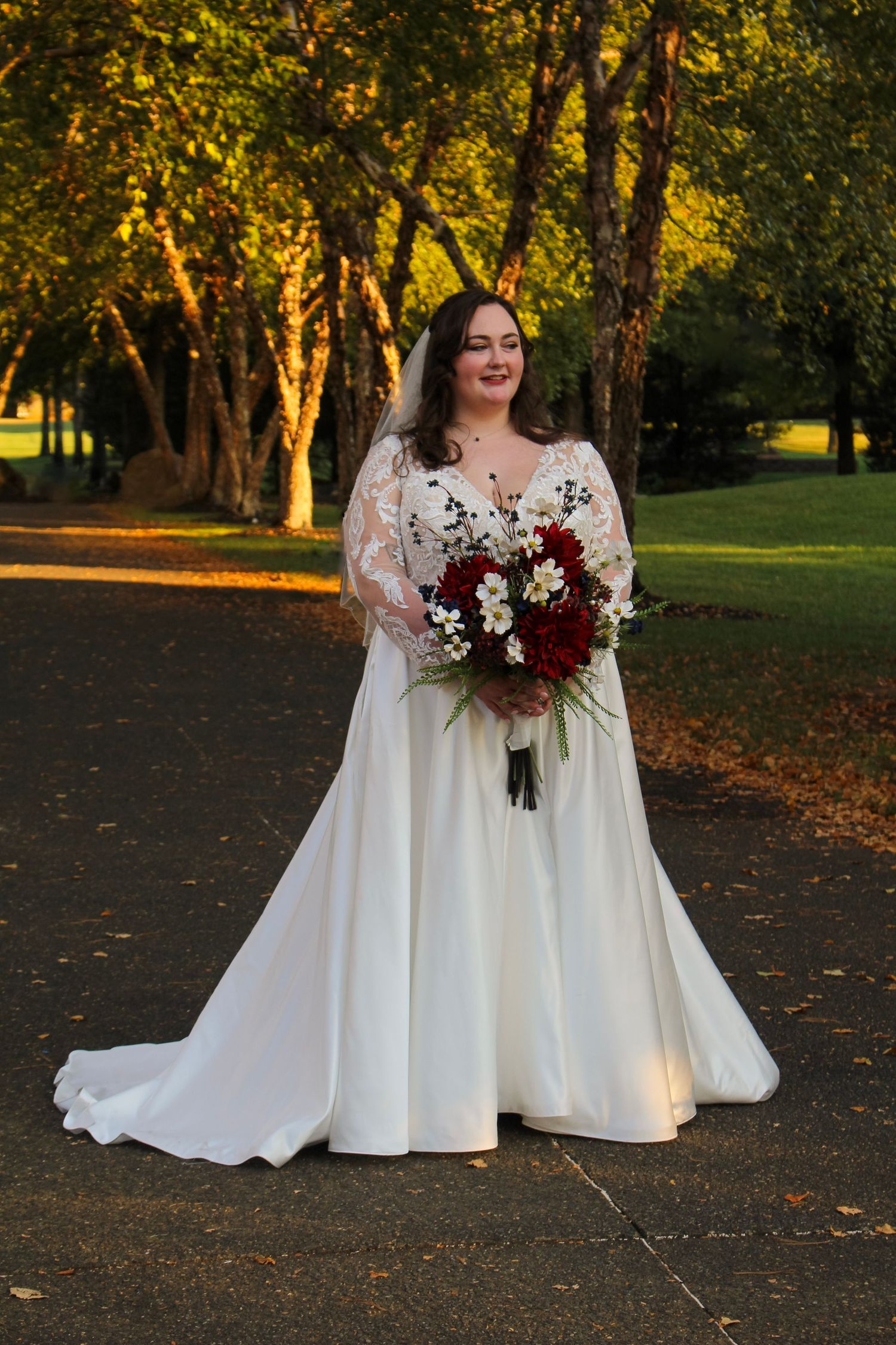 This is a photo of the bride posing to get a full length dress shot after the ceremony.