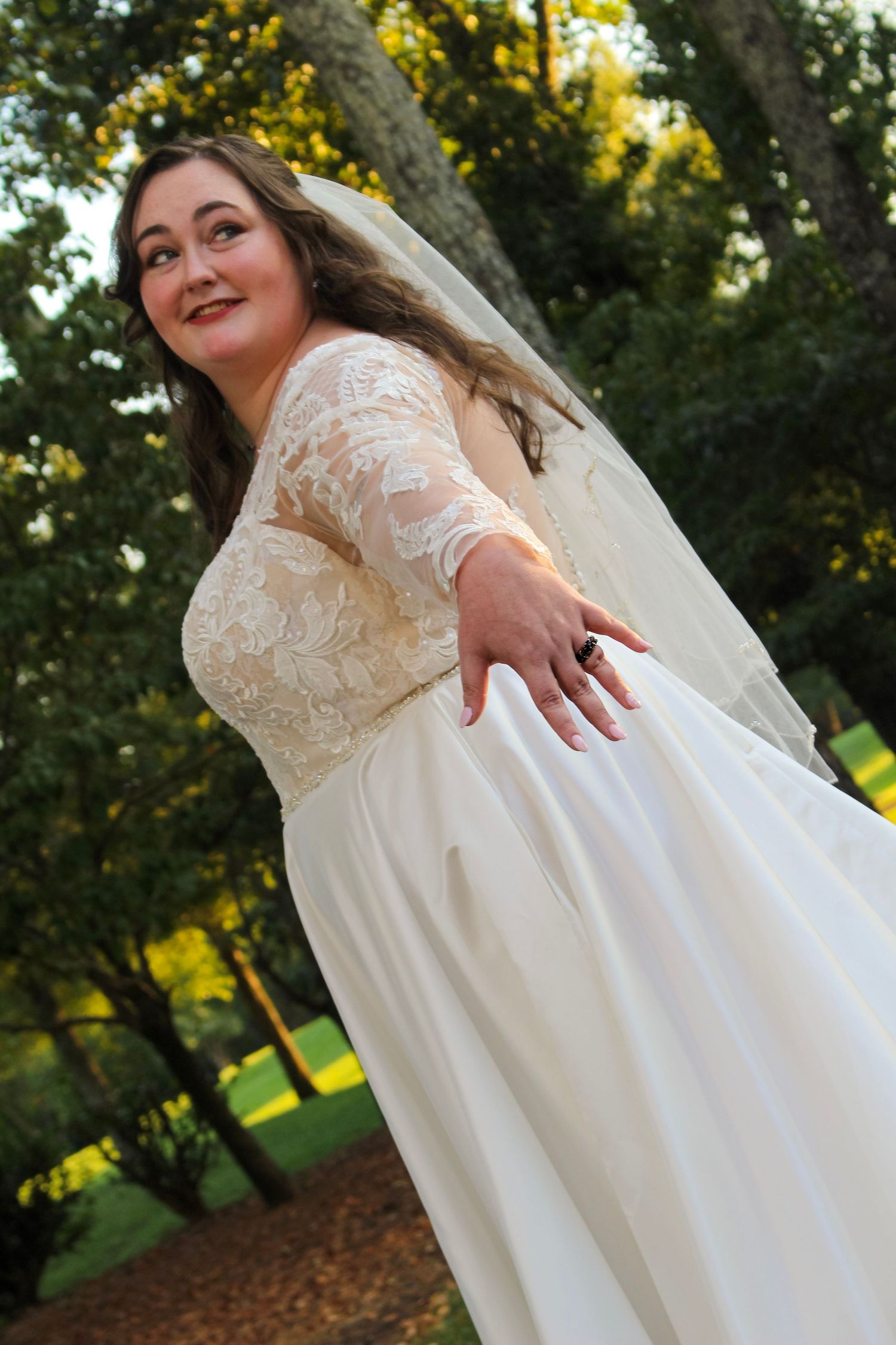 This is another angle of the bride showing off her ring.