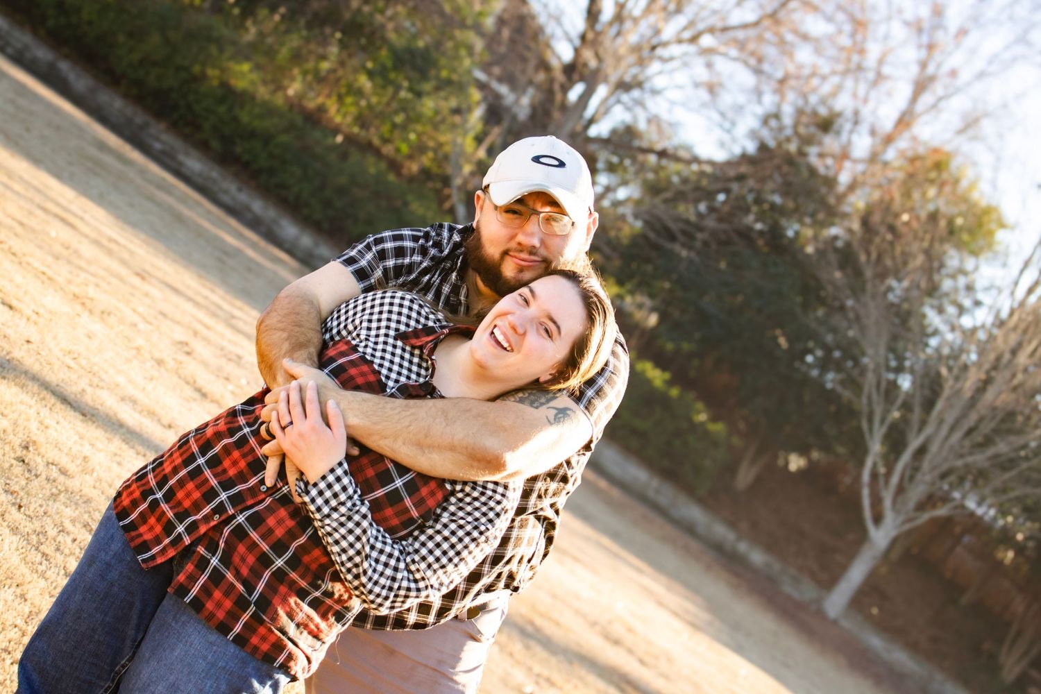 This is photo of the bride and groom to be holding each other.