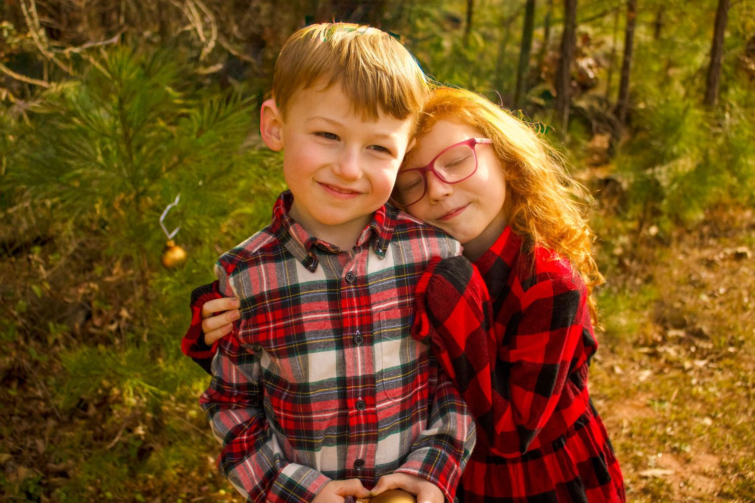 This is a close up angle of two of the kids from the diverse family.