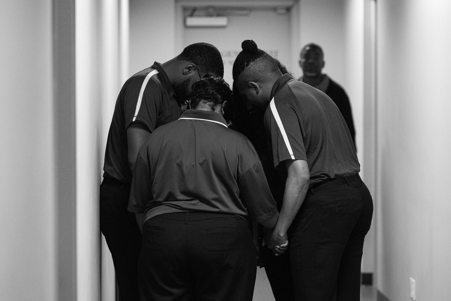 Group of attendees gather in a hallway during a professional event.