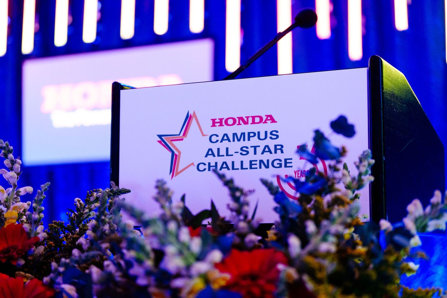 Event stage with Honda and Campus All-Star Challenge branding in blue lighting.