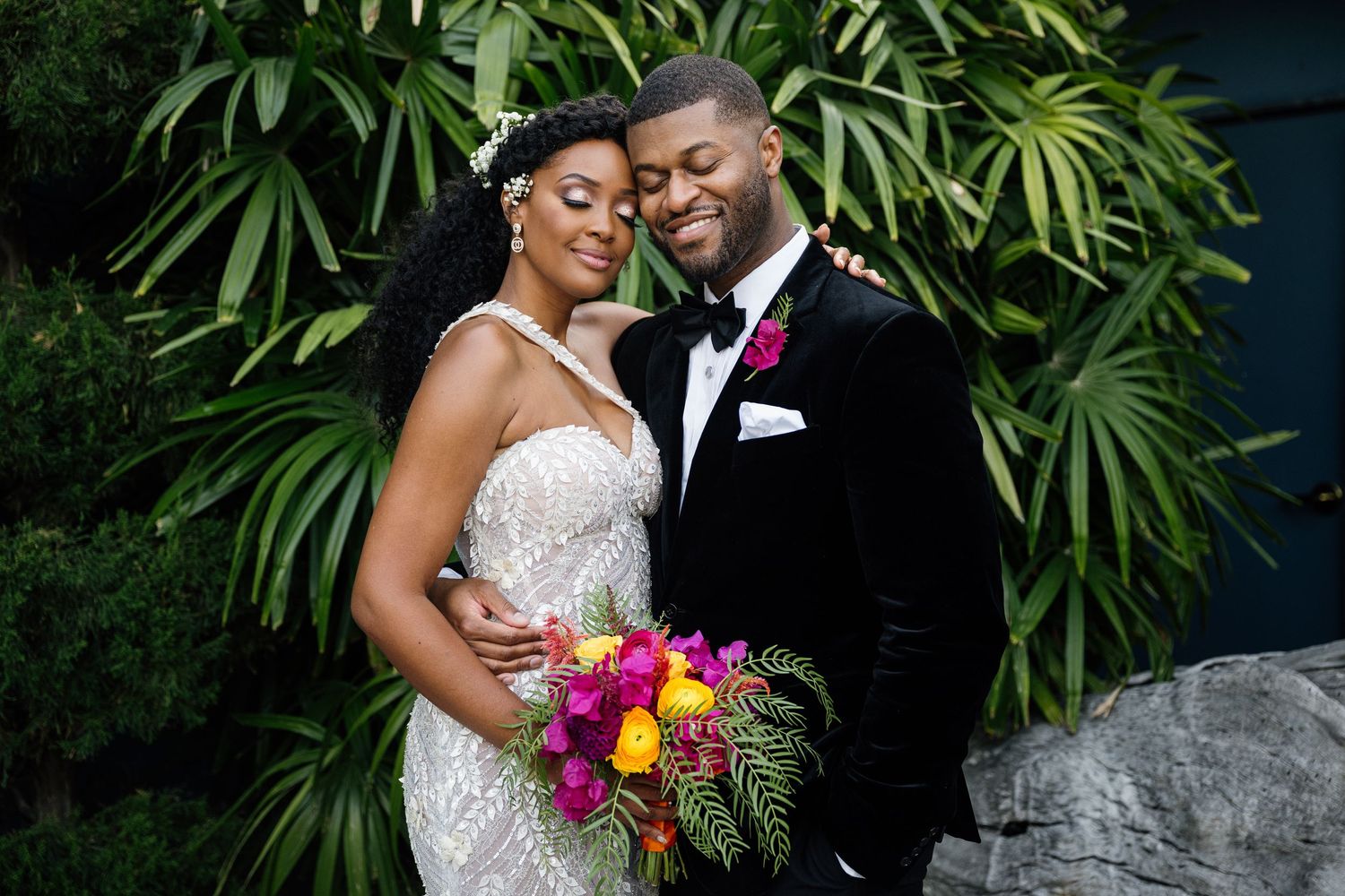 Wedding photography series featuring tropical garden setting with vibrant flowers.