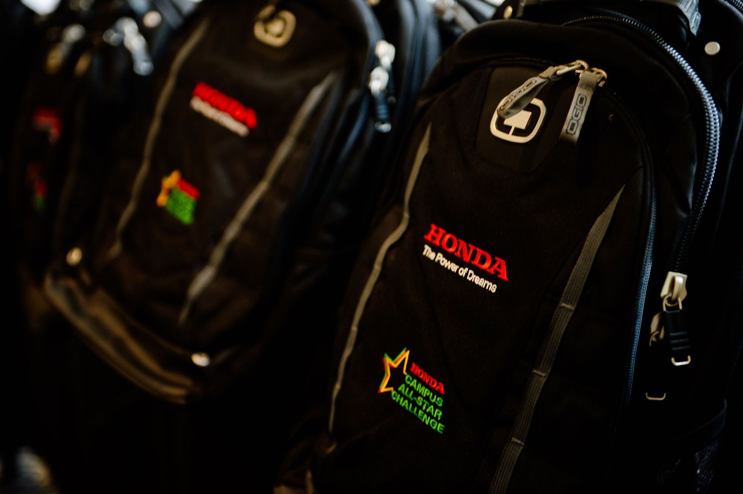 Close-up of professional camera equipment with LED displays in dark setting.