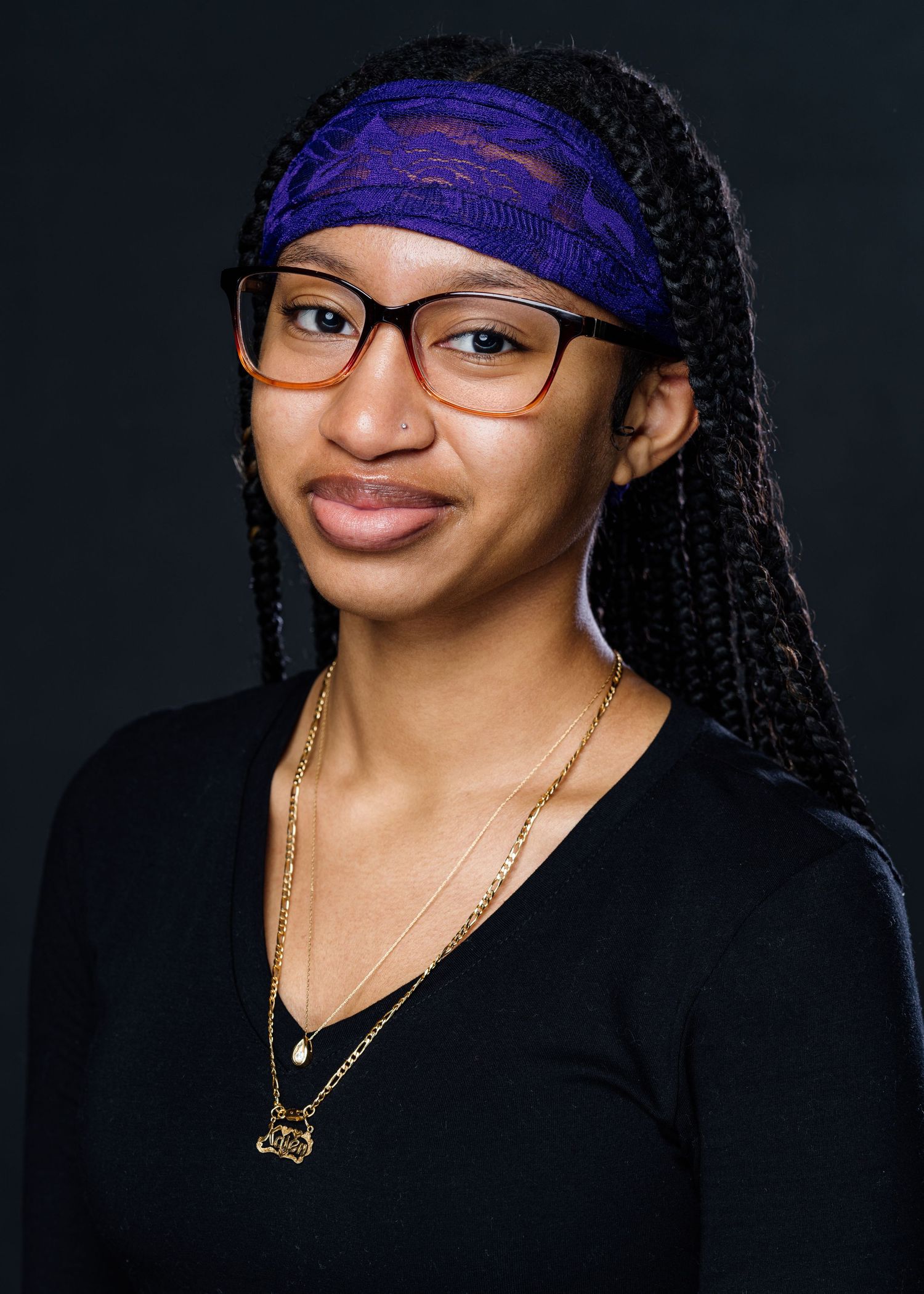 A professional portrait series showing a person in a black top and blue headwrap.
