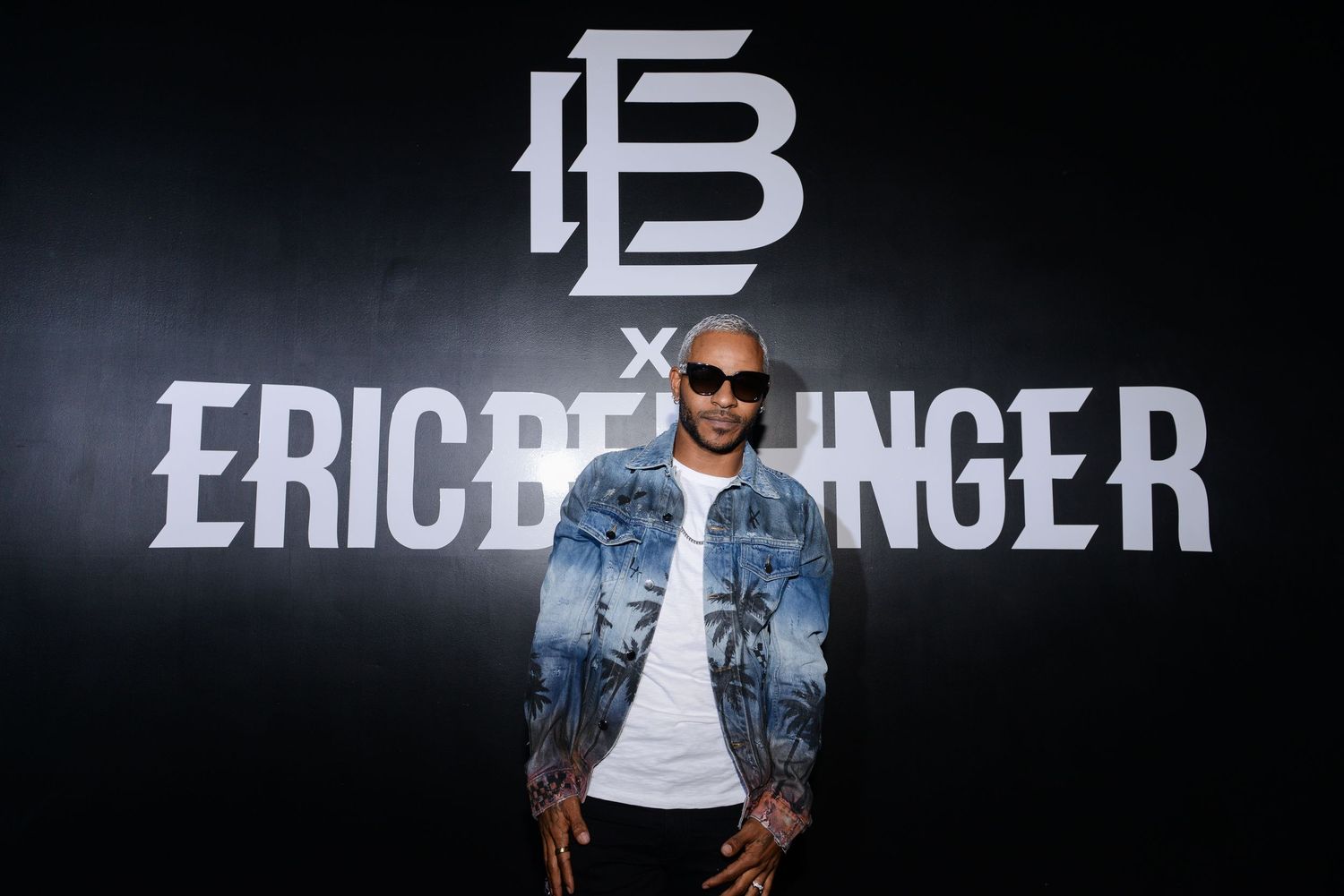 Dark promotional backdrop with Eric Bellinger text and branding.