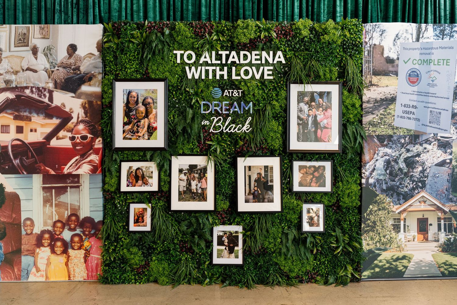 Photo display wall with green foliage background showing various community memories and moments.