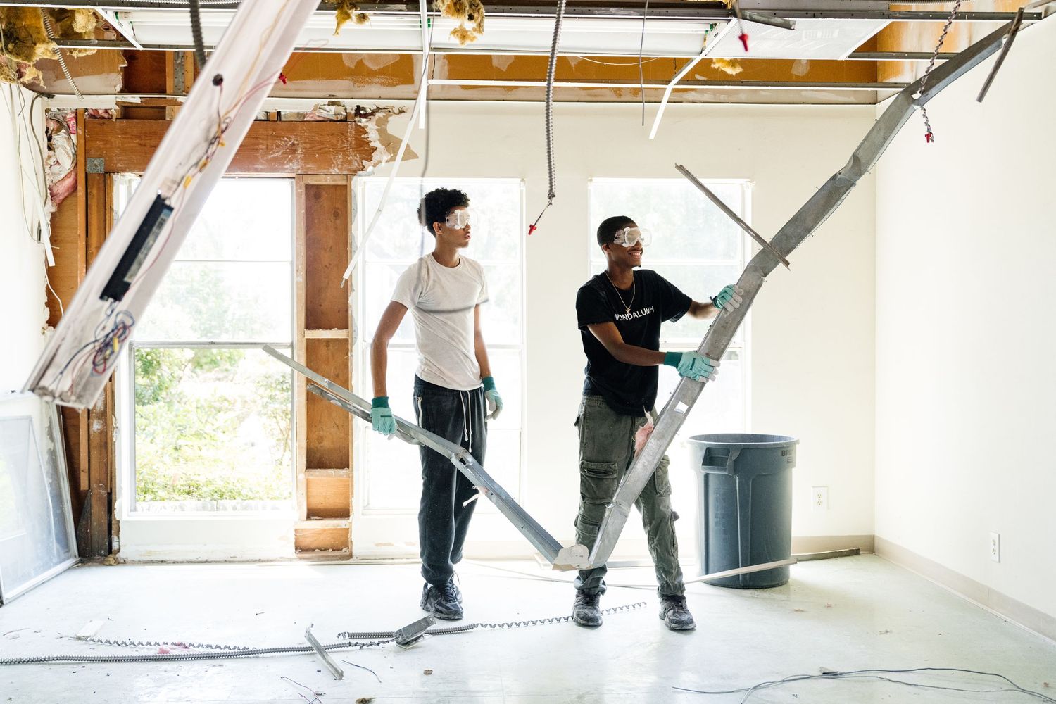 Sequence showing skateboarding tricks and jumps being performed in an indoor space.