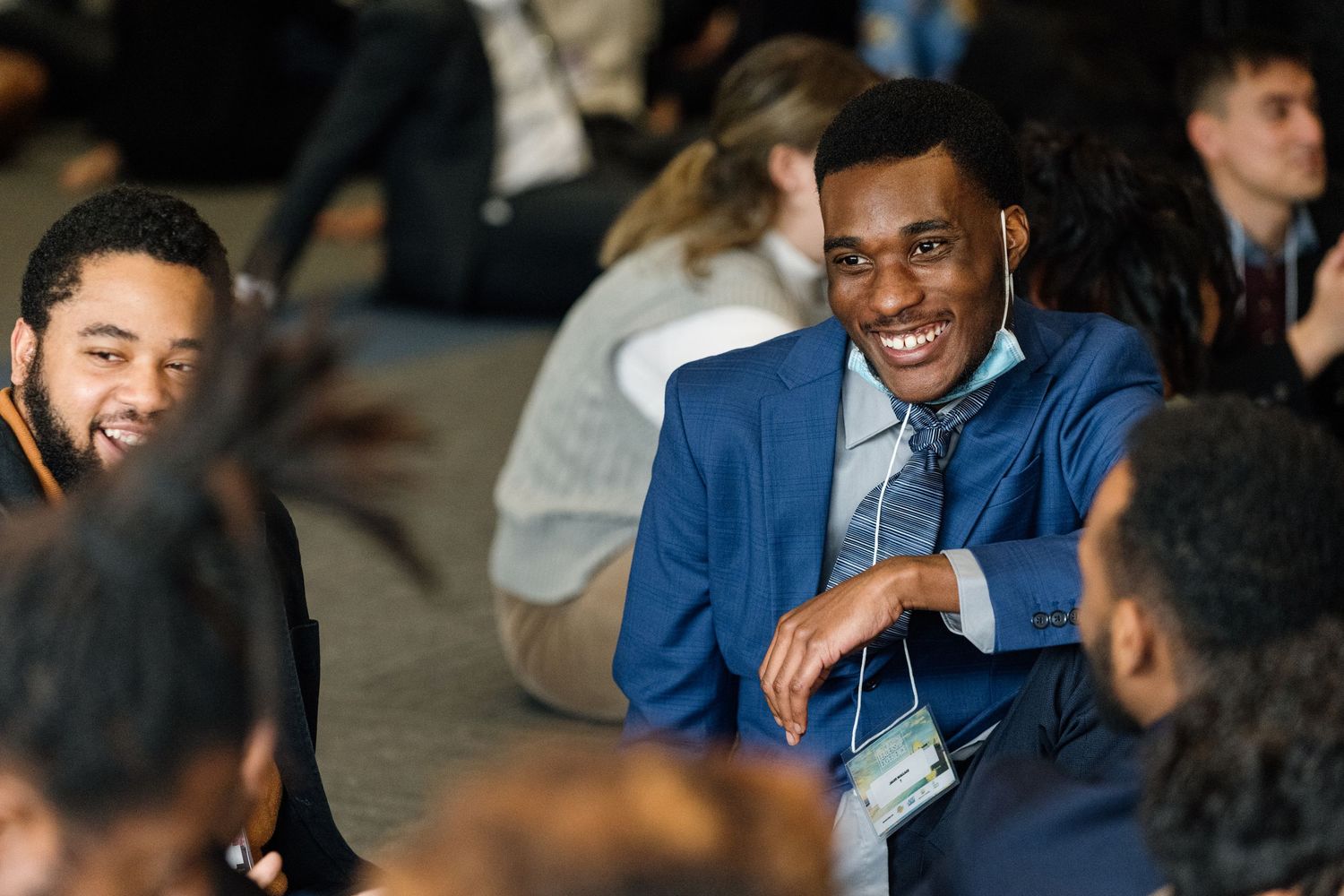 Attendees sharing a lighthearted moment during a professional conference.