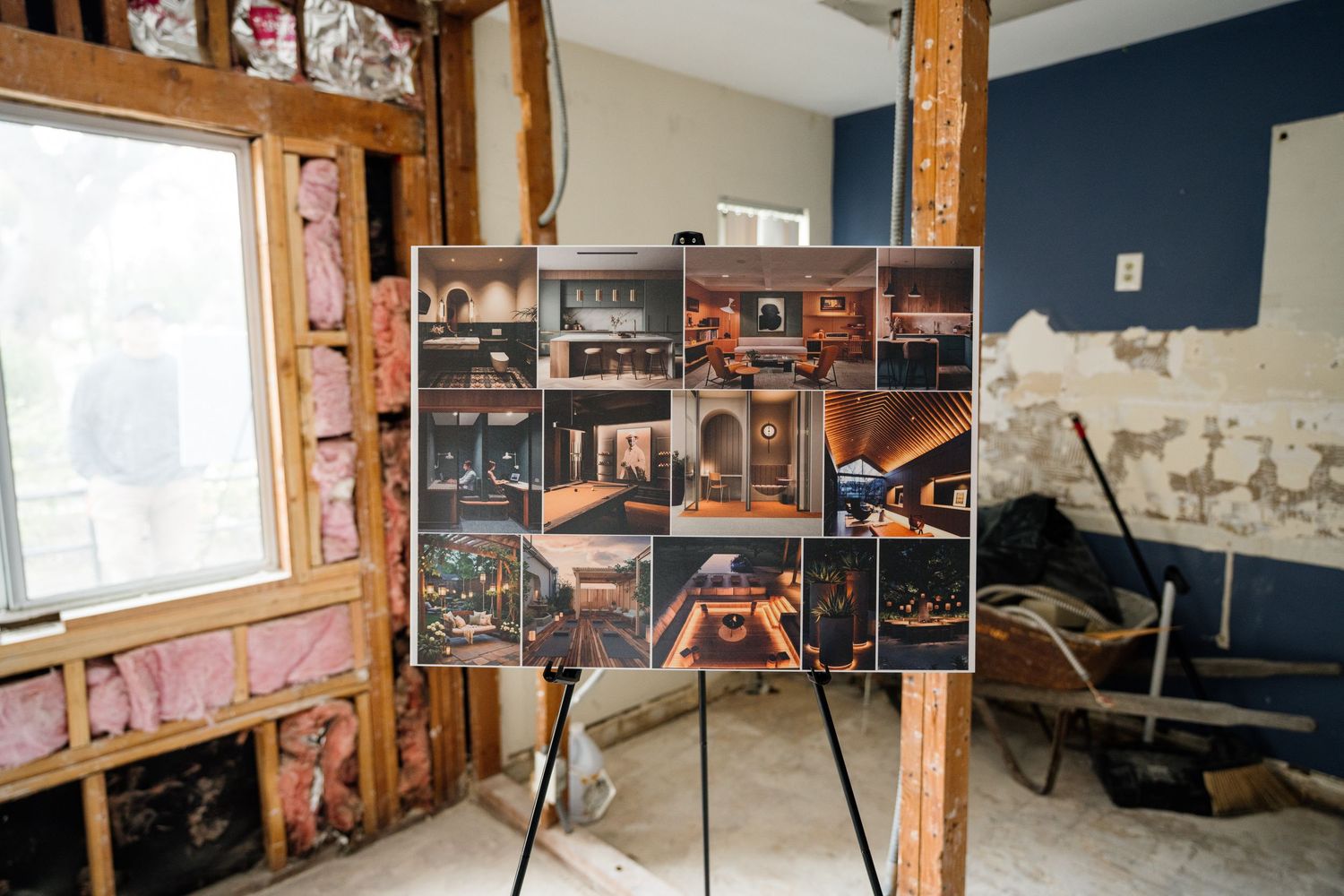 Interior view of room under construction with exposed wooden beams and walls.