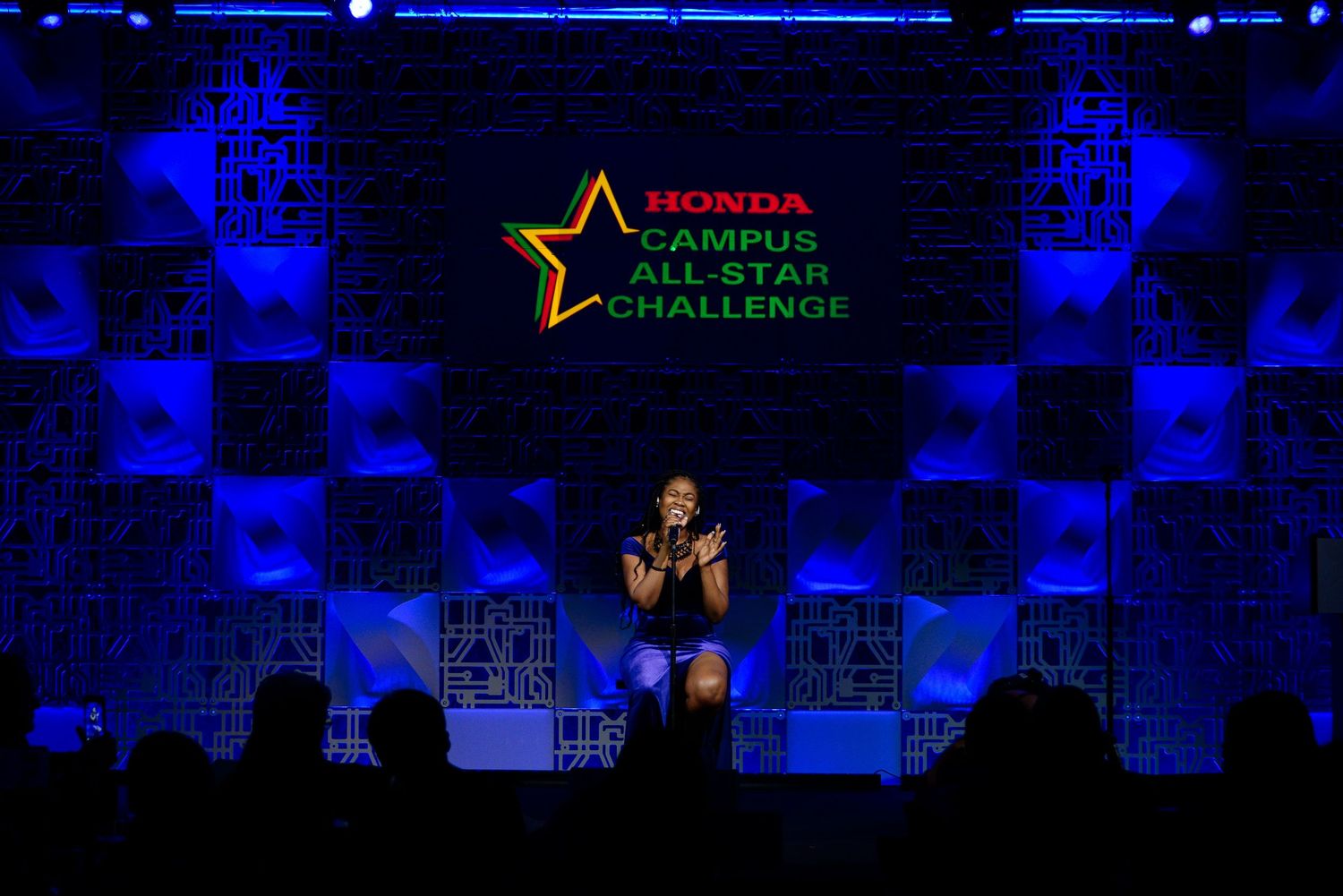 Event stage with blue lighting and Honda Campus All-Star Challenge branding.